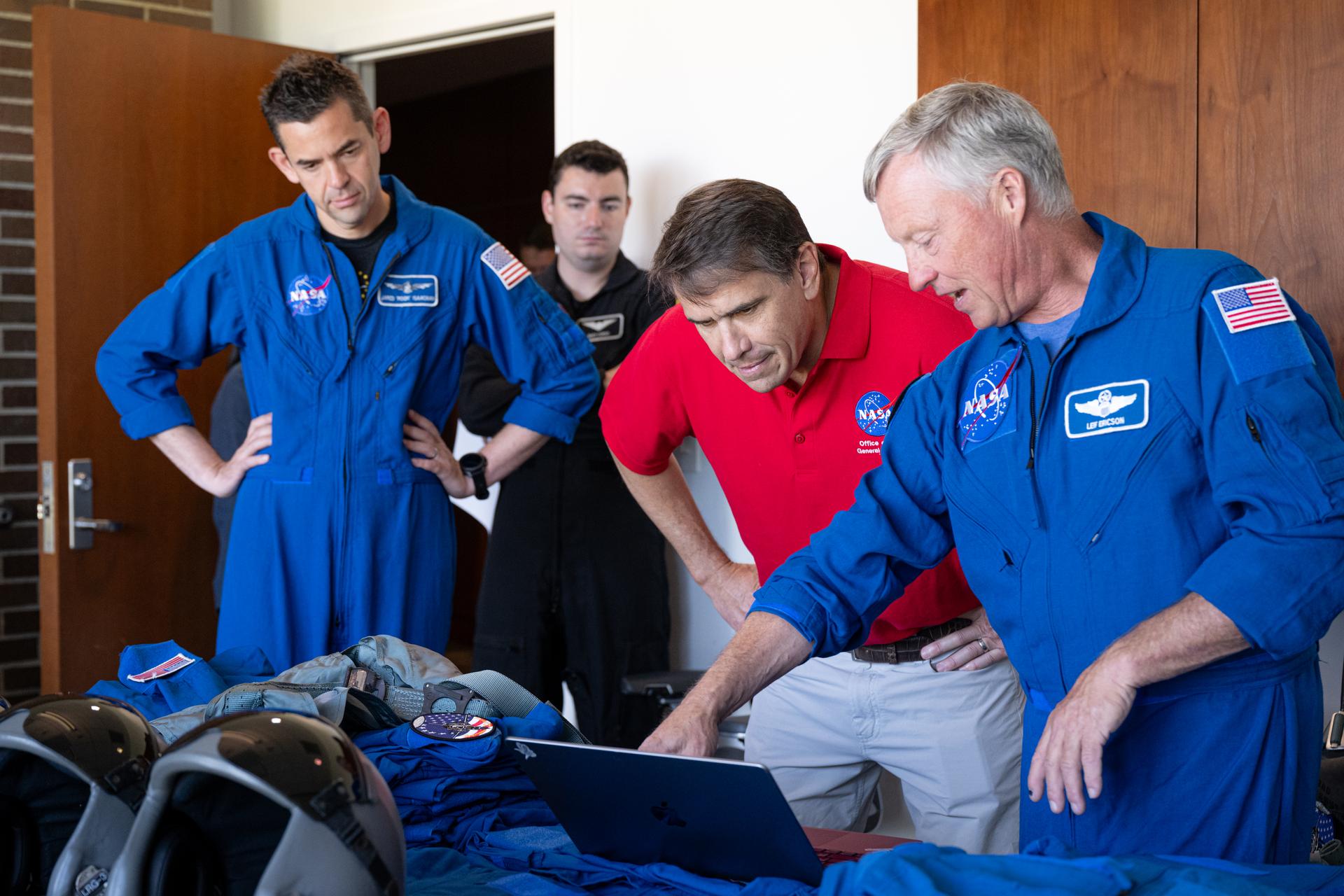 NASA Administrator Jared Isaacman, left; Todd Blanche, Acting U.S. Attorney General, center; and Todd Ericson, senior advisor to the administrator, right, participate in a preflight briefing, Saturday, July 4, 2026, at Joint Base Andrews in Prince George's County, Maryland. NASA aircraft conducted flyovers during the Great American State Fair in Washington, D.C. Photo Credit: (NASA/John Kraus)