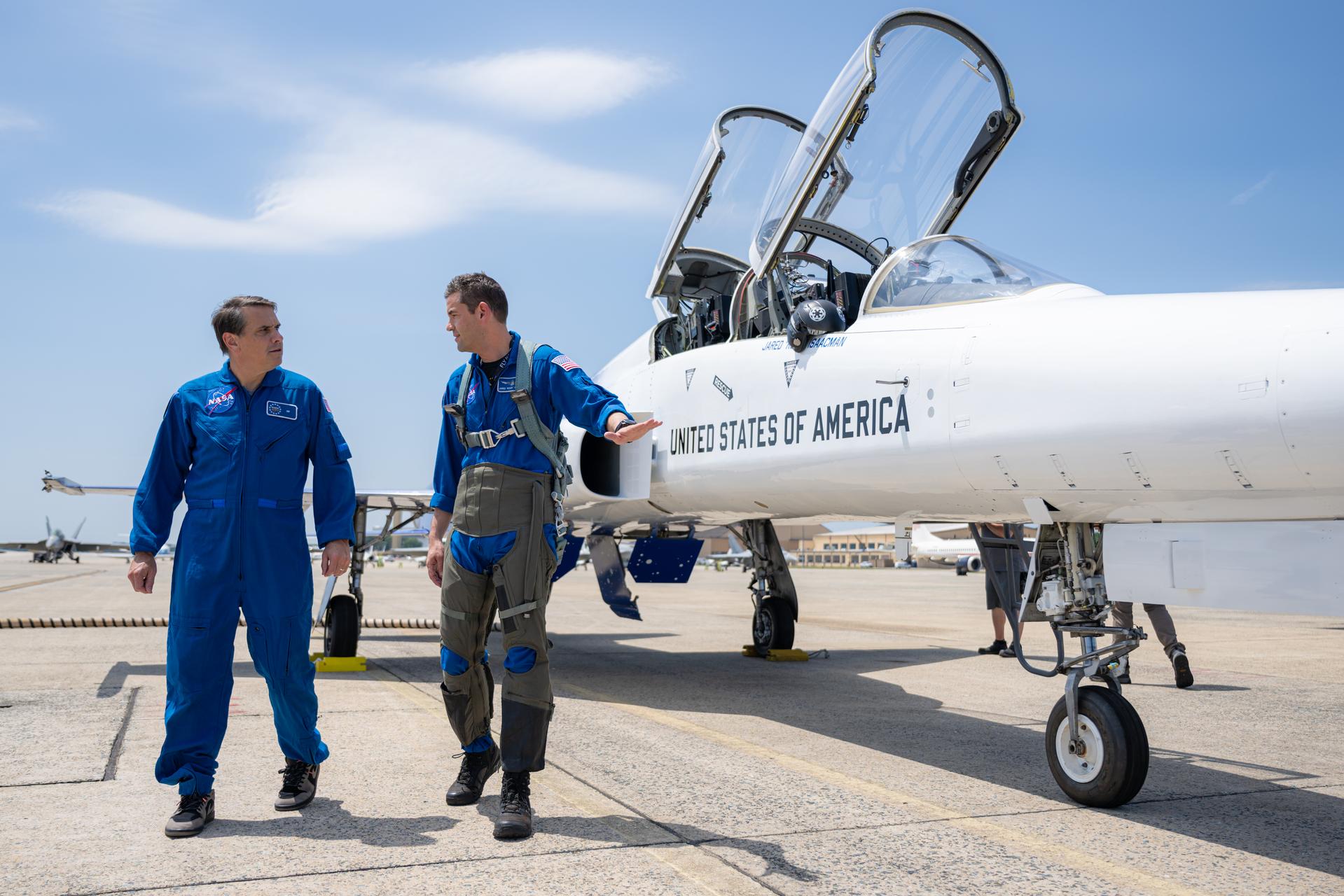 NASA Administrator Jared Isaacman, right, and Todd Blanche, Acting U.S. Attorney General, left, are seen during a preflight walk-around of an F-5 aircraft, Saturday, July 4, 2026, at Joint Base Andrews in Prince George's County, Maryland. NASA aircraft conducted flyovers during the Great American State Fair in Washington, D.C. Photo Credit: (NASA/John Kraus)