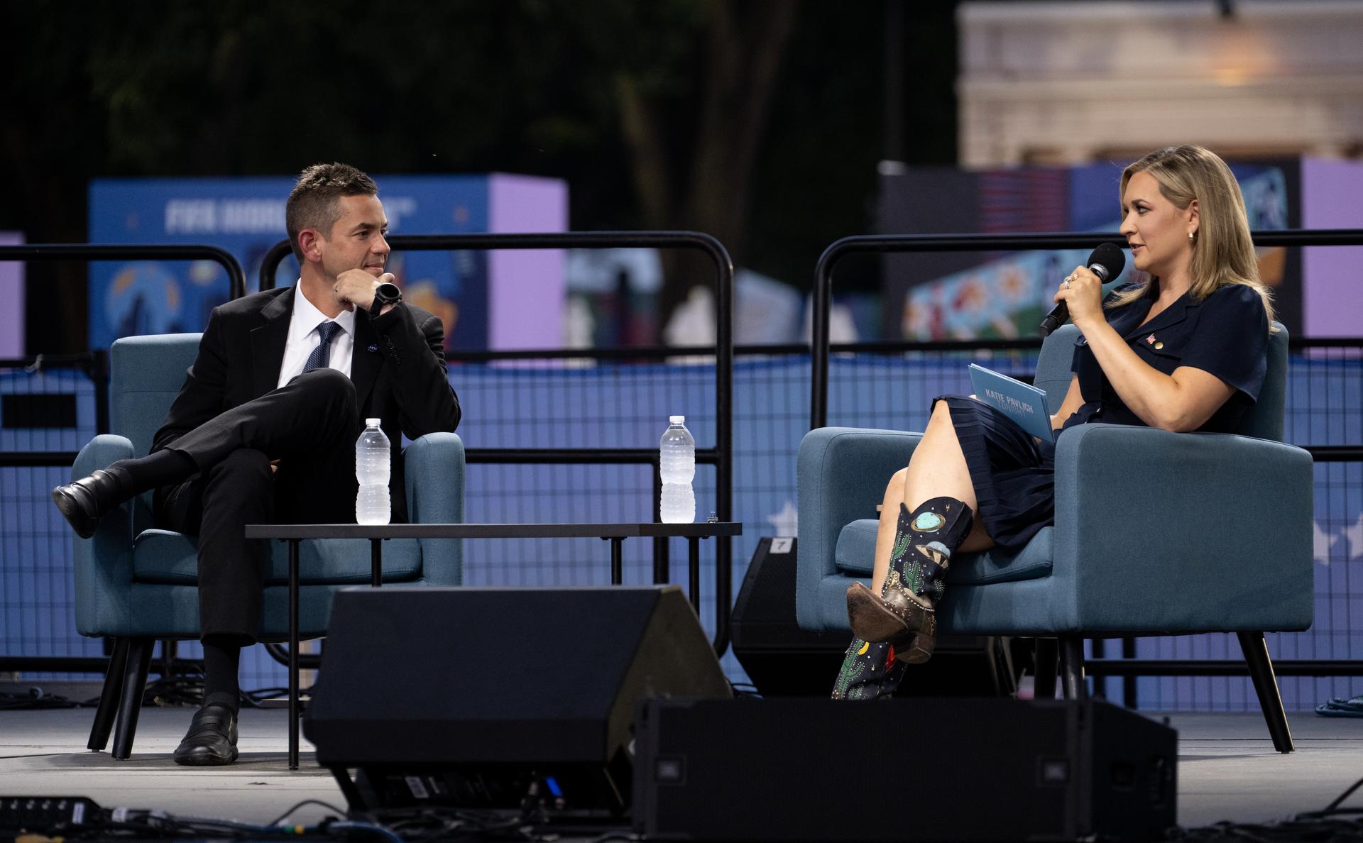 NASA Administrator Jared Isaacman, left, is seen in conversation with Katie Pavlich about the past, present, and future of space exploration on the Freedom Stage at the Great American State Fair, Wednesday, July 8, 2026, on the National Mall in Washington, D.C.  Photo Credit: (NASA/Joel Kowsky)