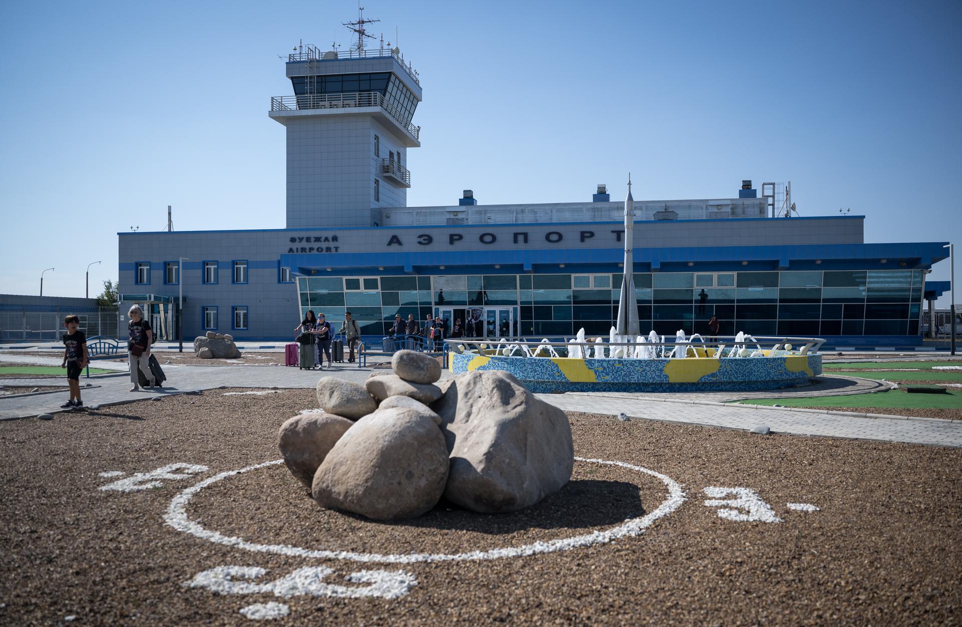 NASA team members and guest arrive at the Krayniy Airport in Baikonur, Kazakhstan in advance of the launch of Expedition 75 crewmembers: NASA astronaut Anil Menon, Roscosmos cosmonauts Pyotr Dubrov and Anna Kikina Friday, July 10, 2026. Menon, Dubrov, and Kikina are scheduled to launch to the International Space Station on July 14. Photo Credit: (NASA/Bill Ingalls)