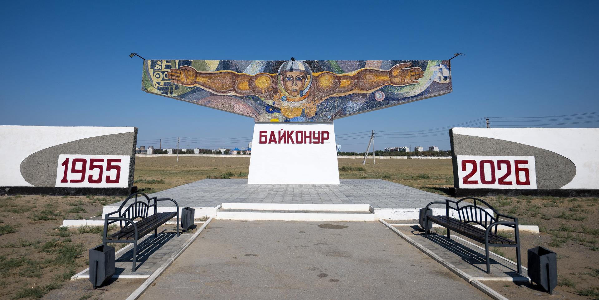 A mosaic sign welcomes visitors outside the town of Baikonur, Kazakhstan, Friday, July 10, 2026. NASA team members arrived in Baikonur in advance of the July 14 launch of Expedition 75 crewmembers: NASA astronaut Anil Menon, Roscosmos cosmonauts Pyotr Dubrov, and Anna Kikina. Photo Credit: (NASA/Bill Ingalls)