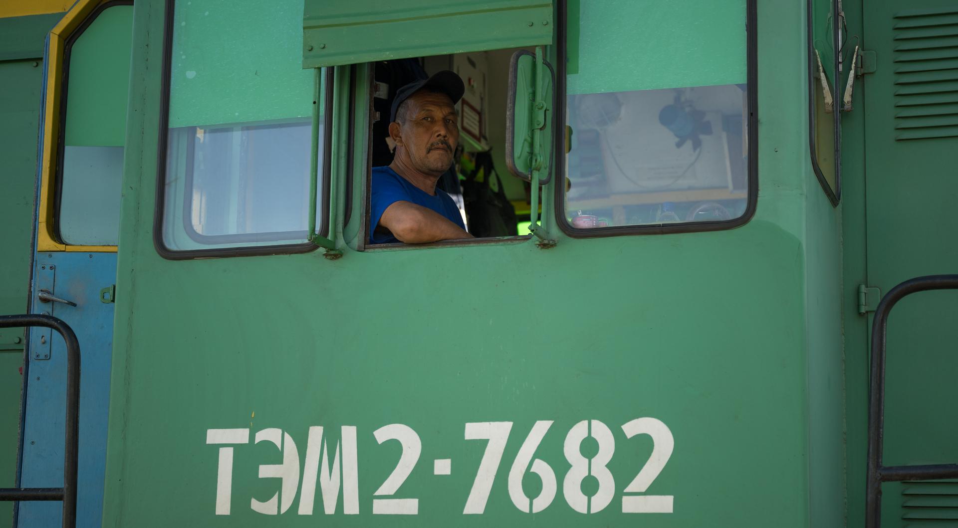 A train engineer waits to support the roll out the Soyuz rocket to the launch pad, Saturday, July 11, 2026, at Site 31 of the Baikonur Cosmodrome in Kazakhstan. Expedition 75 crewmembers: NASA astronaut Anil Menon, Roscosmos cosmonauts Pyotr Dubrov and Anna Kikina are scheduled to launch aboard their Soyuz MS-29 spacecraft on July 14. Photo Credit: (NASA/Bill Ingalls)