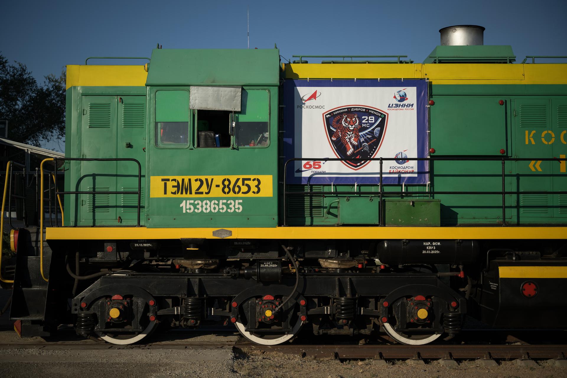 A train, with the Soyuz MS-29 patch on it, prepares to roll the Soyuz rocket out to the launch pad, Saturday, July 11, 2026, at Site 31 of the Baikonur Cosmodrome in Kazakhstan. Expedition 75 crewmembers: NASA astronaut Anil Menon, Roscosmos cosmonauts Pyotr Dubrov and Anna Kikina are scheduled to launch aboard their Soyuz MS-29 spacecraft on July 14. Photo Credit: (NASA/Bill Ingalls)