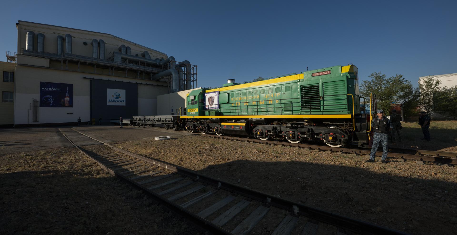 A train sits ready to support the roll out of the Soyuz rocket to the launch pad, Saturday, July 11, 2026, at Site 31 of the Baikonur Cosmodrome in Kazakhstan. Expedition 75 crewmembers: NASA astronaut Anil Menon, Roscosmos cosmonauts Pyotr Dubrov and Anna Kikina are scheduled to launch aboard their Soyuz MS-29 spacecraft on July 14. Photo Credit: (NASA/Bill Ingalls)