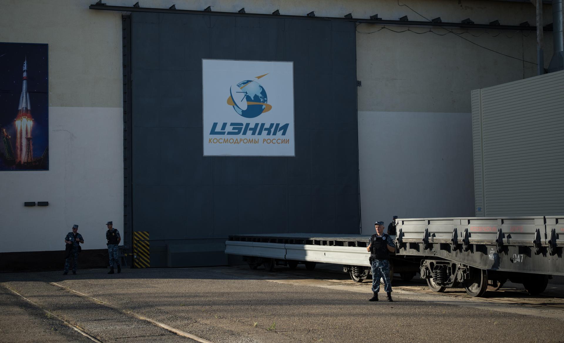 Security teams prepare to support the roll out of the Soyuz rocket by train to the launch pad, Saturday, July 11, 2026, at Site 31 of the Baikonur Cosmodrome in Kazakhstan. Expedition 75 crewmembers: NASA astronaut Anil Menon, Roscosmos cosmonauts Pyotr Dubrov and Anna Kikina are scheduled to launch aboard their Soyuz MS-29 spacecraft on July 14. Photo Credit: (NASA/Bill Ingalls)