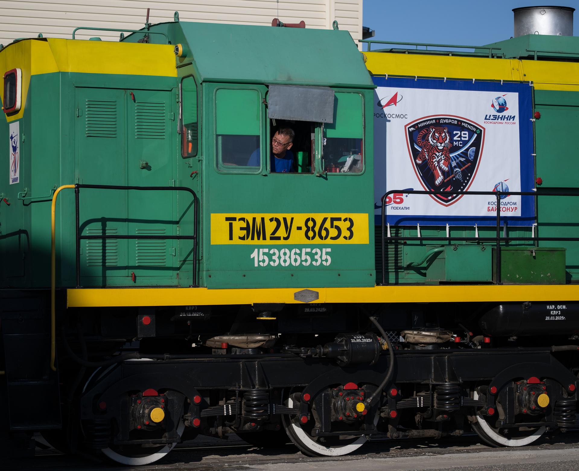 A train supports the roll out of the Soyuz rocket to the launch pad, Saturday, July 11, 2026, at Site 31 of the Baikonur Cosmodrome in Kazakhstan. Expedition 75 crewmembers: NASA astronaut Anil Menon, Roscosmos cosmonauts Pyotr Dubrov and Anna Kikina are scheduled to launch aboard their Soyuz MS-29 spacecraft on July 14. Photo Credit: (NASA/Bill Ingalls)