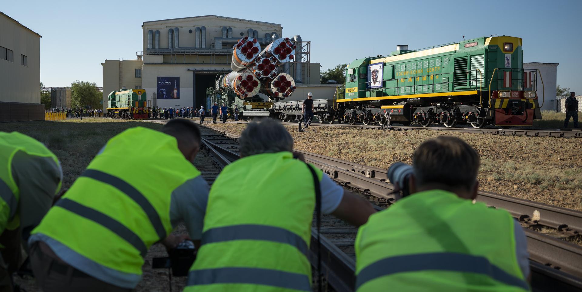 The Soyuz rocket is rolled out by train to the launch pad, Saturday, July 11, 2026, at Site 31 of the Baikonur Cosmodrome in Kazakhstan. Expedition 75 crewmembers: NASA astronaut Anil Menon, Roscosmos cosmonauts Pyotr Dubrov and Anna Kikina are scheduled to launch aboard their Soyuz MS-29 spacecraft on July 14. Photo Credit: (NASA/Bill Ingalls)
