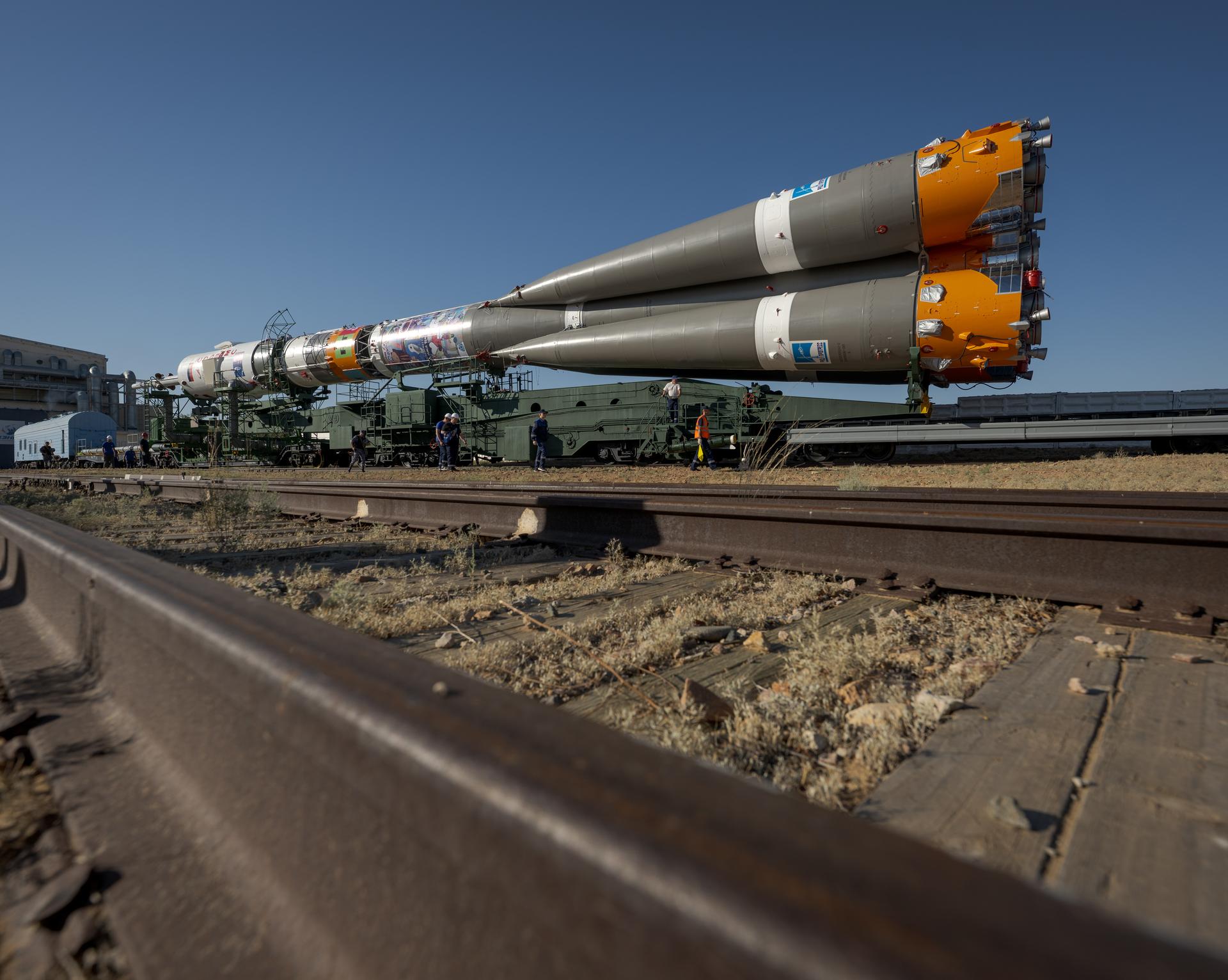 The Soyuz rocket is rolled out by train to the launch pad, Saturday, July 11, 2026, at Site 31 of the Baikonur Cosmodrome in Kazakhstan. Expedition 75 crewmembers: NASA astronaut Anil Menon, Roscosmos cosmonauts Pyotr Dubrov and Anna Kikina are scheduled to launch aboard their Soyuz MS-29 spacecraft on July 14. Photo Credit: (NASA/Bill Ingalls)