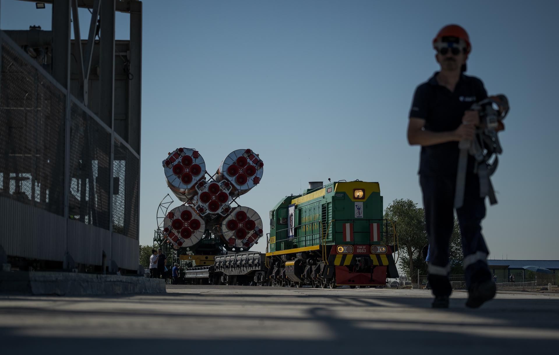 The Soyuz rocket is rolled out by train to the launch pad, Saturday, July 11, 2026, at Site 31 of the Baikonur Cosmodrome in Kazakhstan. Expedition 75 crewmembers: NASA astronaut Anil Menon, Roscosmos cosmonauts Pyotr Dubrov and Anna Kikina are scheduled to launch aboard their Soyuz MS-29 spacecraft on July 14. Photo Credit: (NASA/Bill Ingalls)