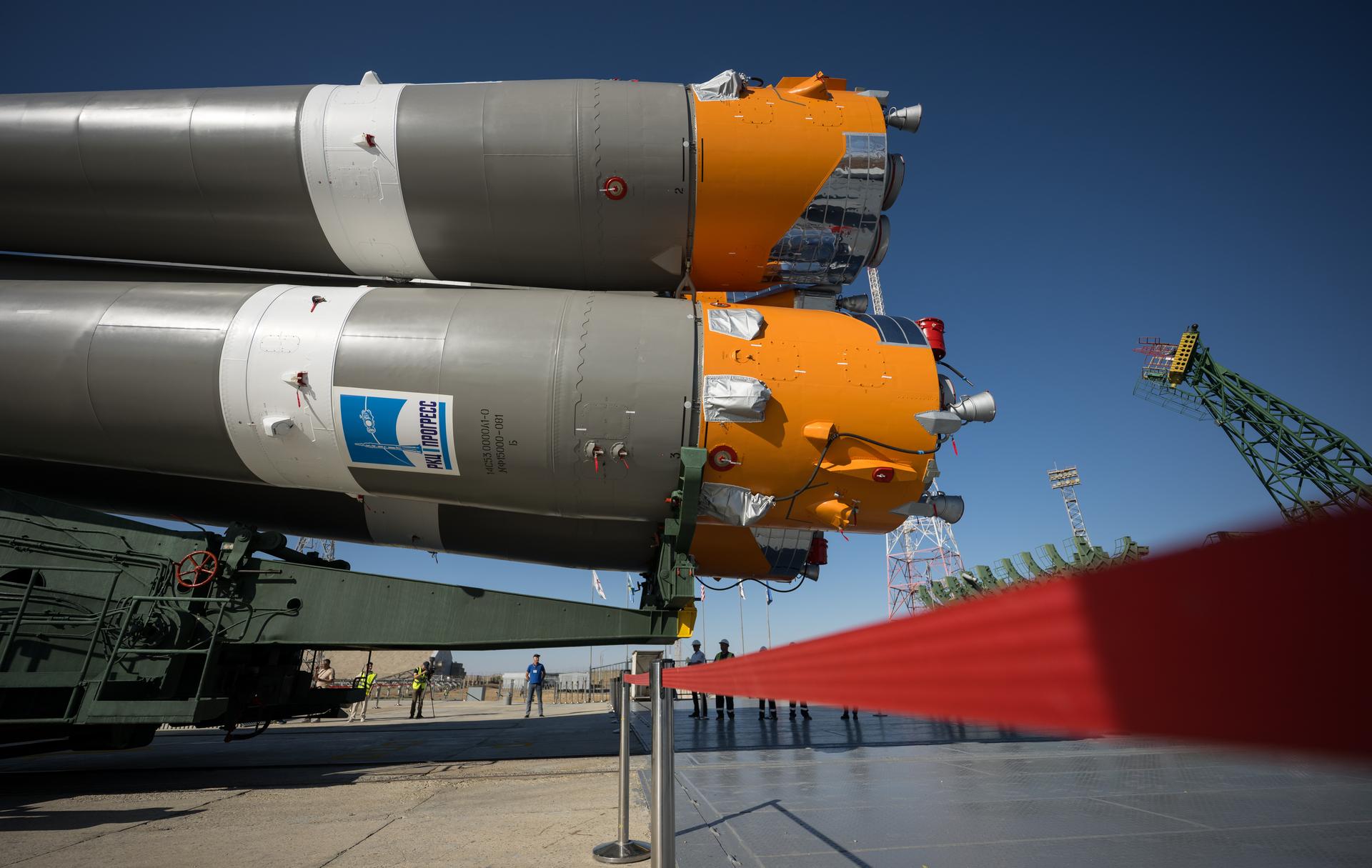The Soyuz rocket is rolled out by train to the launch pad, Saturday, July 11, 2026, at Site 31 of the Baikonur Cosmodrome in Kazakhstan. Expedition 75 crewmembers: NASA astronaut Anil Menon, Roscosmos cosmonauts Pyotr Dubrov and Anna Kikina are scheduled to launch aboard their Soyuz MS-29 spacecraft on July 14. Photo Credit: (NASA/Bill Ingalls)