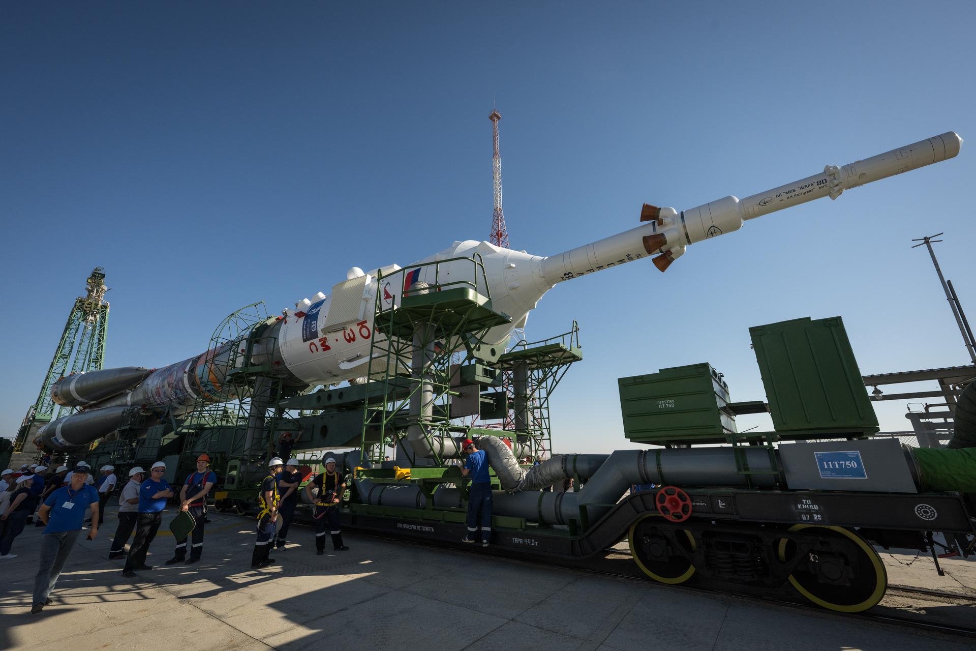 The Soyuz rocket is rolled out by train to the launch pad, Saturday, July 11, 2026, at Site 31 of the Baikonur Cosmodrome in Kazakhstan. Expedition 75 crewmembers: NASA astronaut Anil Menon, Roscosmos cosmonauts Pyotr Dubrov and Anna Kikina are scheduled to launch aboard their Soyuz MS-29 spacecraft on July 14. Photo Credit: (NASA/Bill Ingalls)