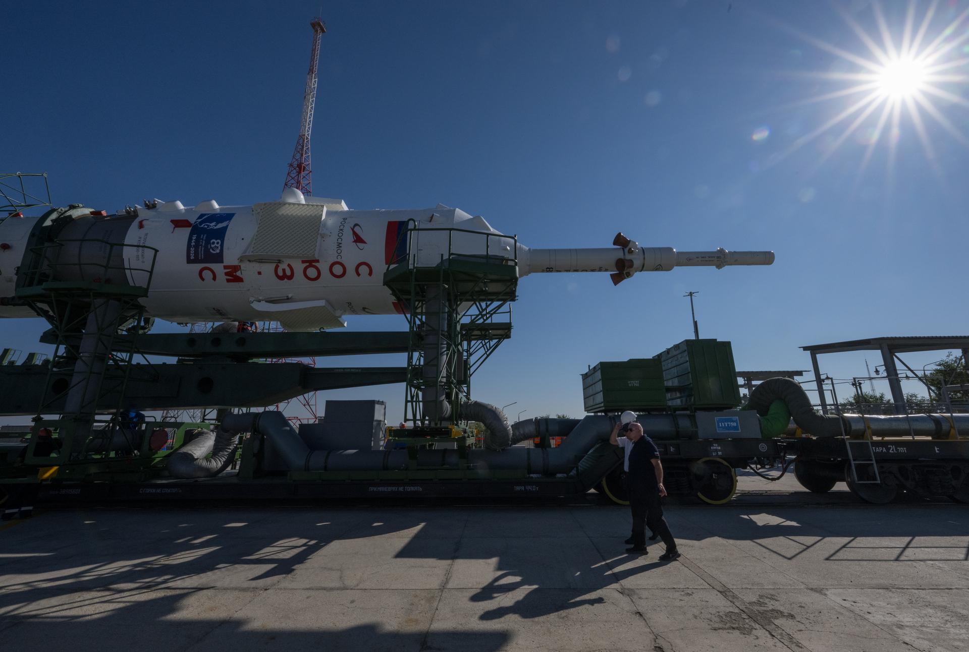 The Soyuz rocket is rolled out by train to the launch pad, Saturday, July 11, 2026, at Site 31 of the Baikonur Cosmodrome in Kazakhstan. Expedition 75 crewmembers: NASA astronaut Anil Menon, Roscosmos cosmonauts Pyotr Dubrov and Anna Kikina are scheduled to launch aboard their Soyuz MS-29 spacecraft on July 14. Photo Credit: (NASA/Bill Ingalls)