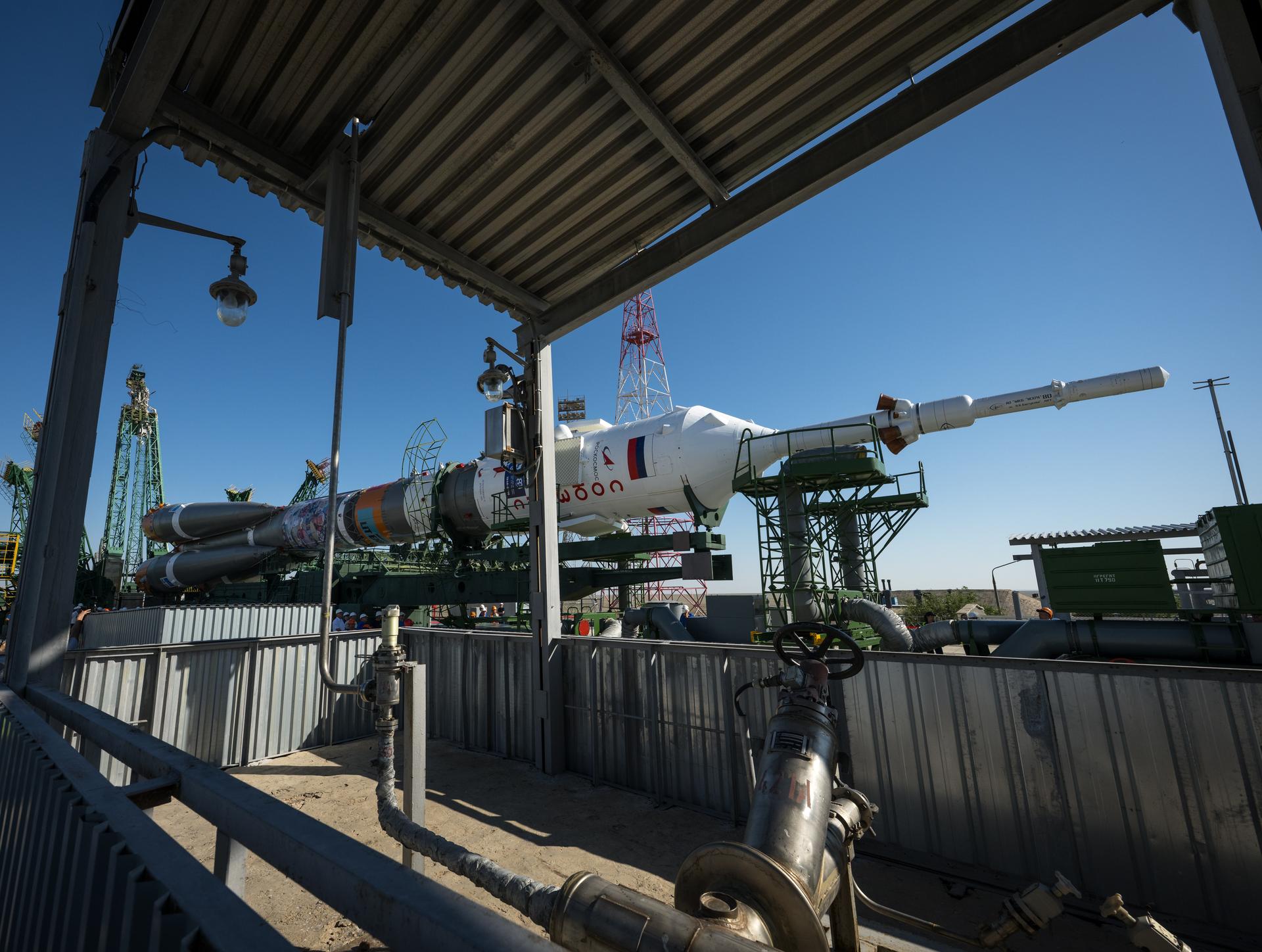 The Soyuz rocket is rolled out by train to the launch pad, Saturday, July 11, 2026, at Site 31 of the Baikonur Cosmodrome in Kazakhstan. Expedition 75 crewmembers: NASA astronaut Anil Menon, Roscosmos cosmonauts Pyotr Dubrov and Anna Kikina are scheduled to launch aboard their Soyuz MS-29 spacecraft on July 14. Photo Credit: (NASA/Bill Ingalls)