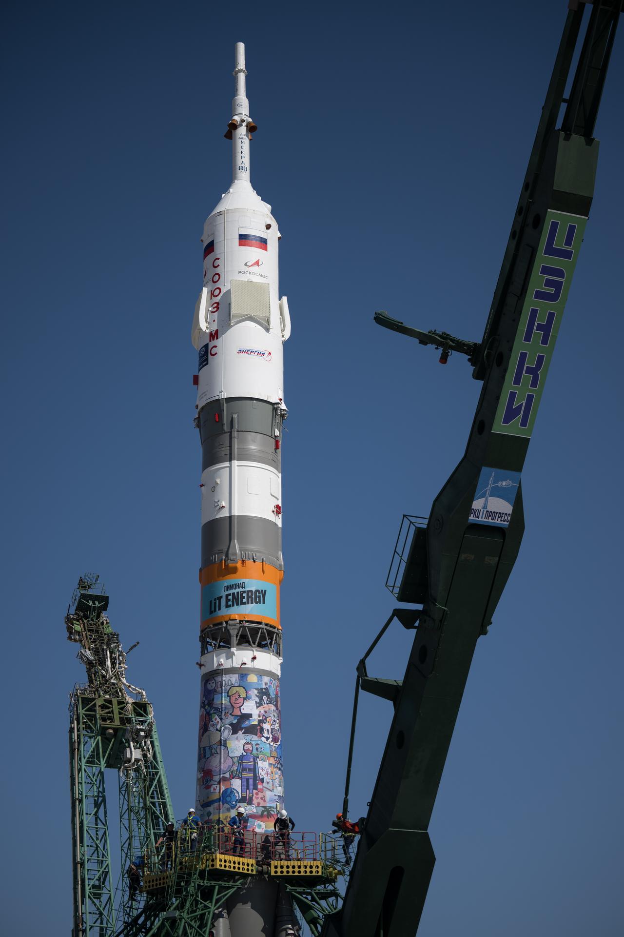 The Soyuz rocket is raised into position at the Site 31 launch pad of the Baikonur Cosmodrome in Kazakhstan, Saturday, July 11, 2026. Expedition 75 crewmembers: NASA astronaut Anil Menon, Roscosmos cosmonauts Pyotr Dubrov and Anna Kikina are scheduled to launch aboard their Soyuz MS-29 spacecraft on July 14. Photo Credit: (NASA/Bill Ingalls)