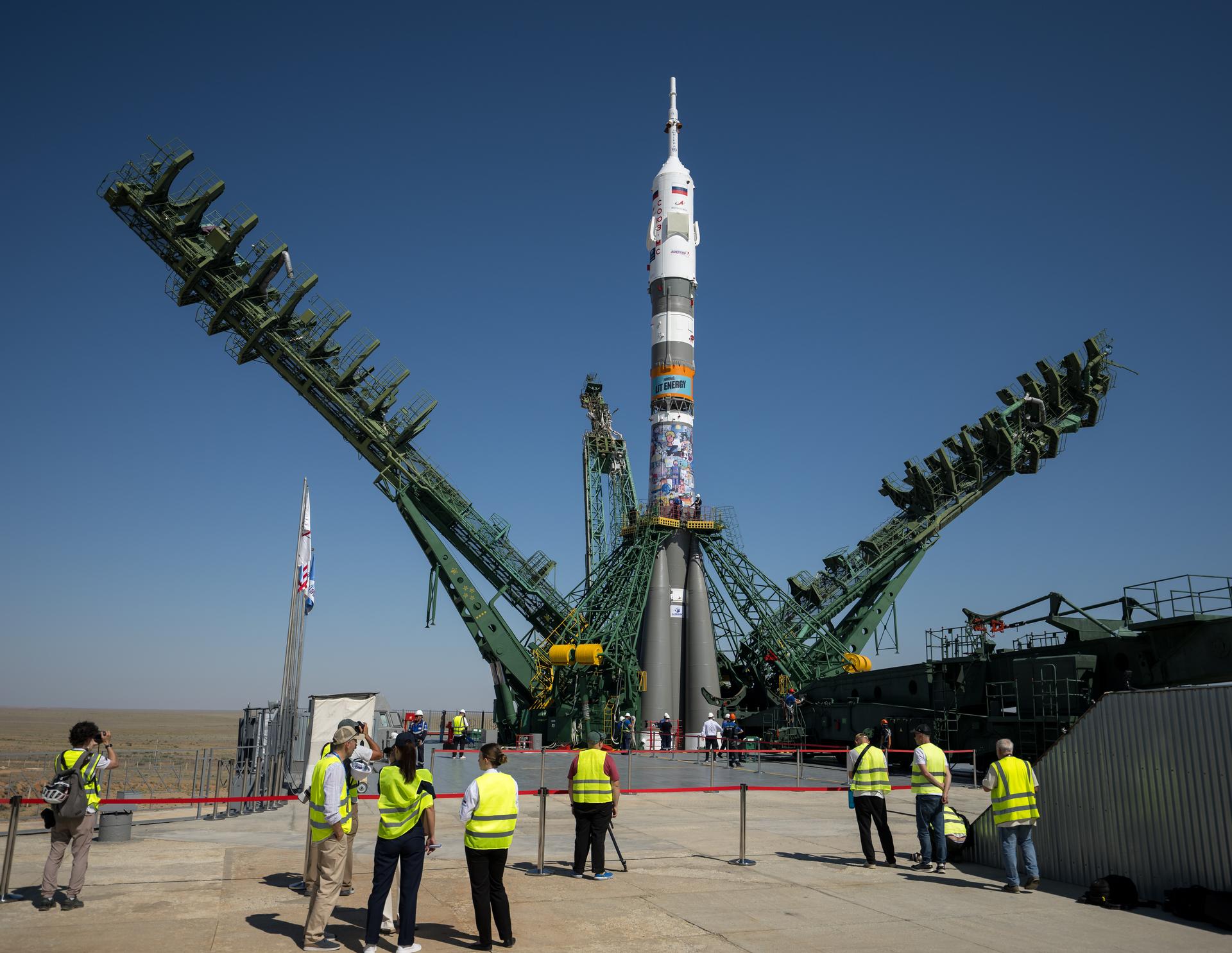 The gantry arms are raised around the Soyuz rocket after it was rolled out to the Site 31 launch pad of the Baikonur Cosmodrome in Kazakhstan, Saturday, July 11, 2026. Expedition 75 crewmembers: NASA astronaut Anil Menon, Roscosmos cosmonauts Pyotr Dubrov and Anna Kikina are scheduled to launch aboard their Soyuz MS-29 spacecraft on July 14. Photo Credit: (NASA/Bill Ingalls)