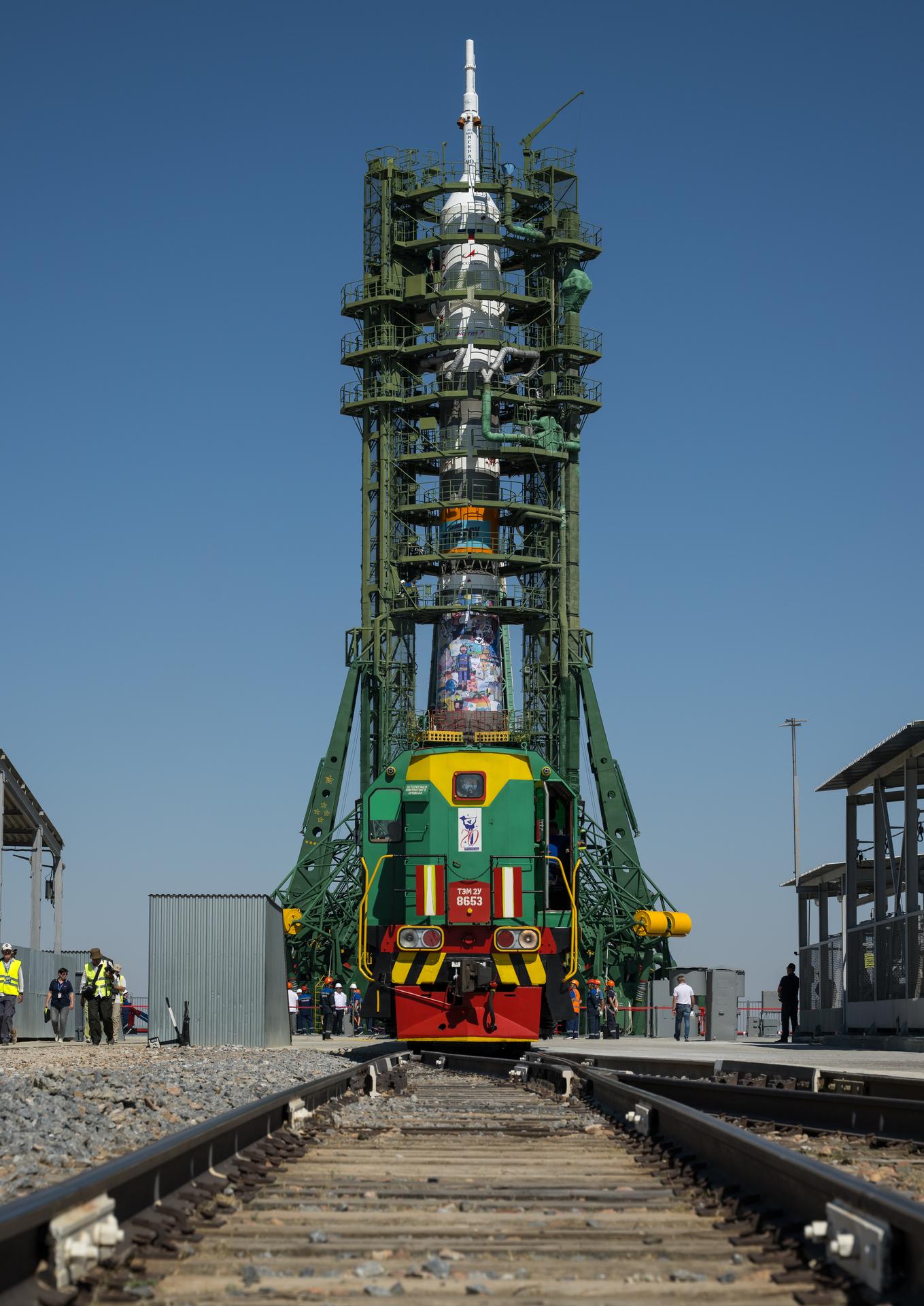 The gantry arms are raised around the Soyuz rocket after it was rolled out to the Site 31 launch pad of the Baikonur Cosmodrome in Kazakhstan, Saturday, July 11, 2026. Expedition 75 crewmembers: NASA astronaut Anil Menon, Roscosmos cosmonauts Pyotr Dubrov and Anna Kikina are scheduled to launch aboard their Soyuz MS-29 spacecraft on July 14. Photo Credit: (NASA/Bill Ingalls)