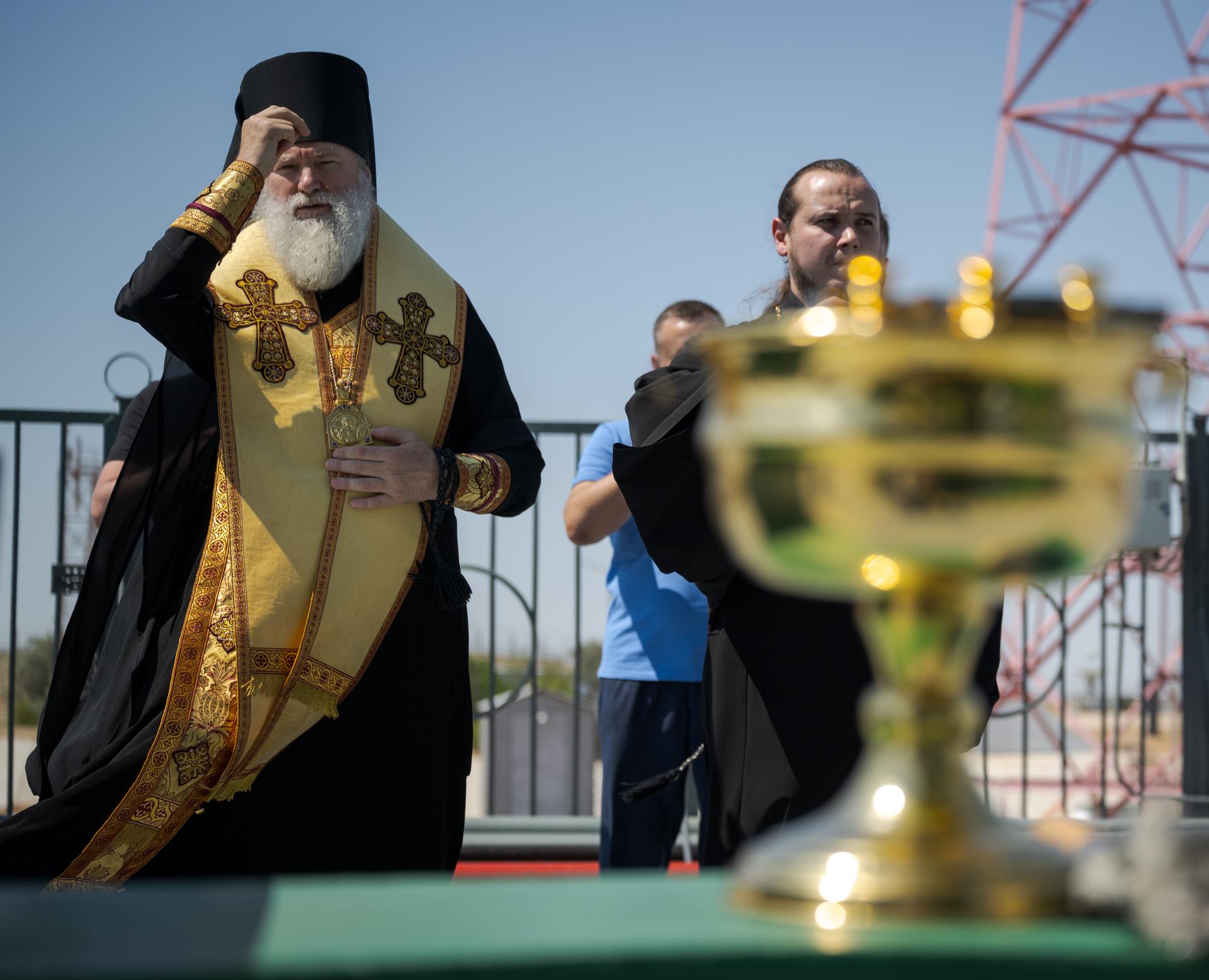 Russian Orthodox Priest blesses the Soyuz rocket, Monday, July 13, 2026 at the Baikonur Cosmodrome Site 31 launch pad in Kazakhstan. Expedition 75 crewmembers: NASA astronaut Anil Menon, Roscosmos cosmonauts Pyotr Dubrov and Anna Kikina are scheduled to launch aboard the Soyuz MS-29 spacecraft to the International Space Station on July 14. Photo Credit: (NASA/Bill Ingalls)