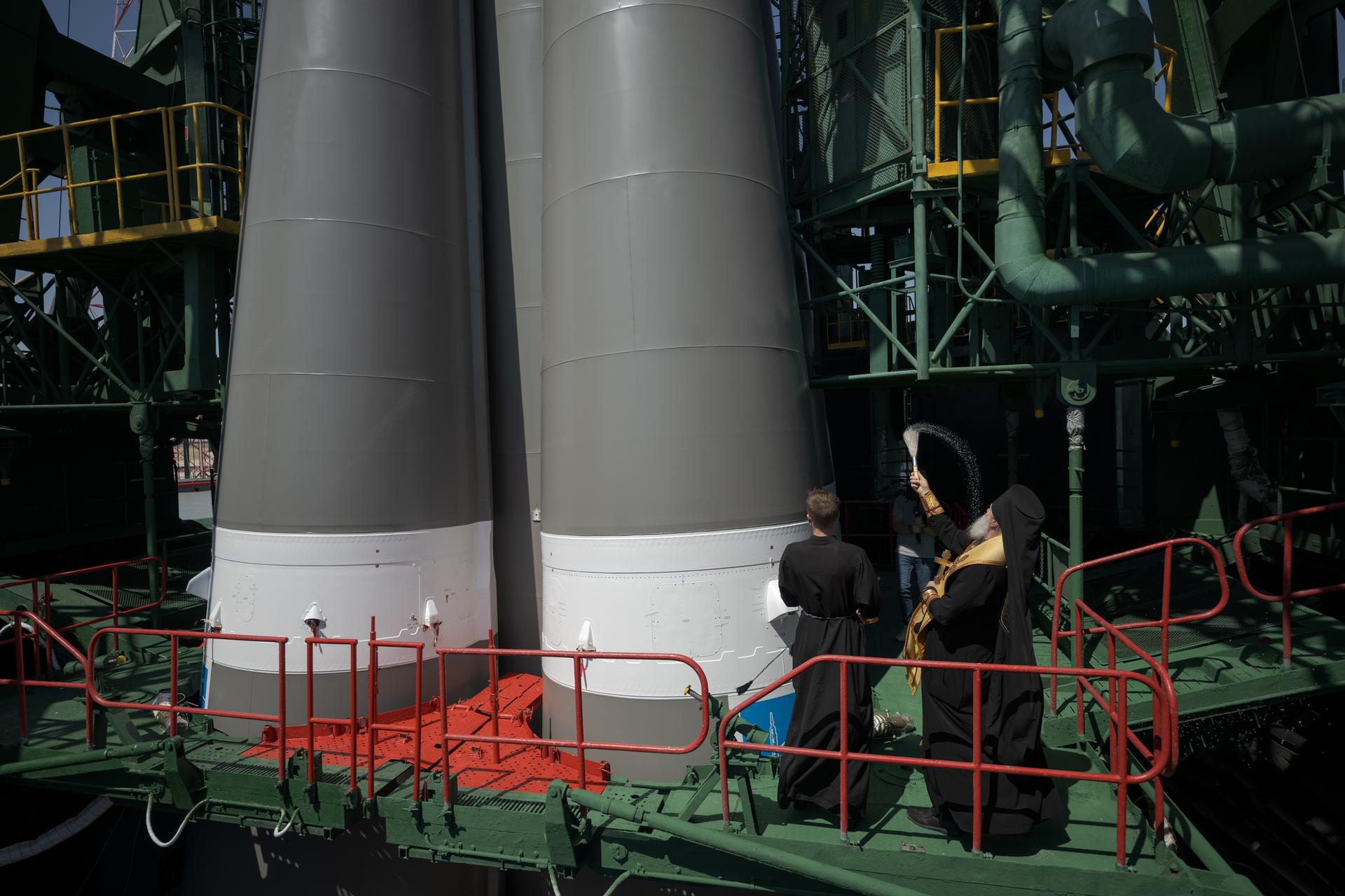 Russian Orthodox Priest blesses the Soyuz rocket, Monday, July 13, 2026 at the Baikonur Cosmodrome Site 31 launch pad in Kazakhstan. Expedition 75 crewmembers: NASA astronaut Anil Menon, Roscosmos cosmonauts Pyotr Dubrov and Anna Kikina are scheduled to launch aboard the Soyuz MS-29 spacecraft to the International Space Station on July 14. Photo Credit: (NASA/Bill Ingalls)
