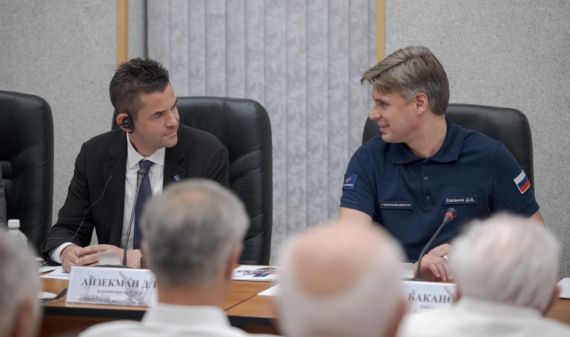 NASA Administrator Jared Isaacman, left, and Roscosmos Director General Dmitry Bakanov are seen during the State Commission meeting to approve the Soyuz launch of Expedition 75 to the International Space Station, Monday, July 13, 2026 at the Cosmonaut Hotel in Baikonur, Kazakhstan. Expedition 75 crewmembers: NASA astronaut Anil Menon, Roscosmos cosmonauts Pyotr Dubrov and Anna Kikina are scheduled to launch aboard the Soyuz MS-29 spacecraft to the International Space Station on July 14. Photo Credit: (NASA/Bill Ingalls)