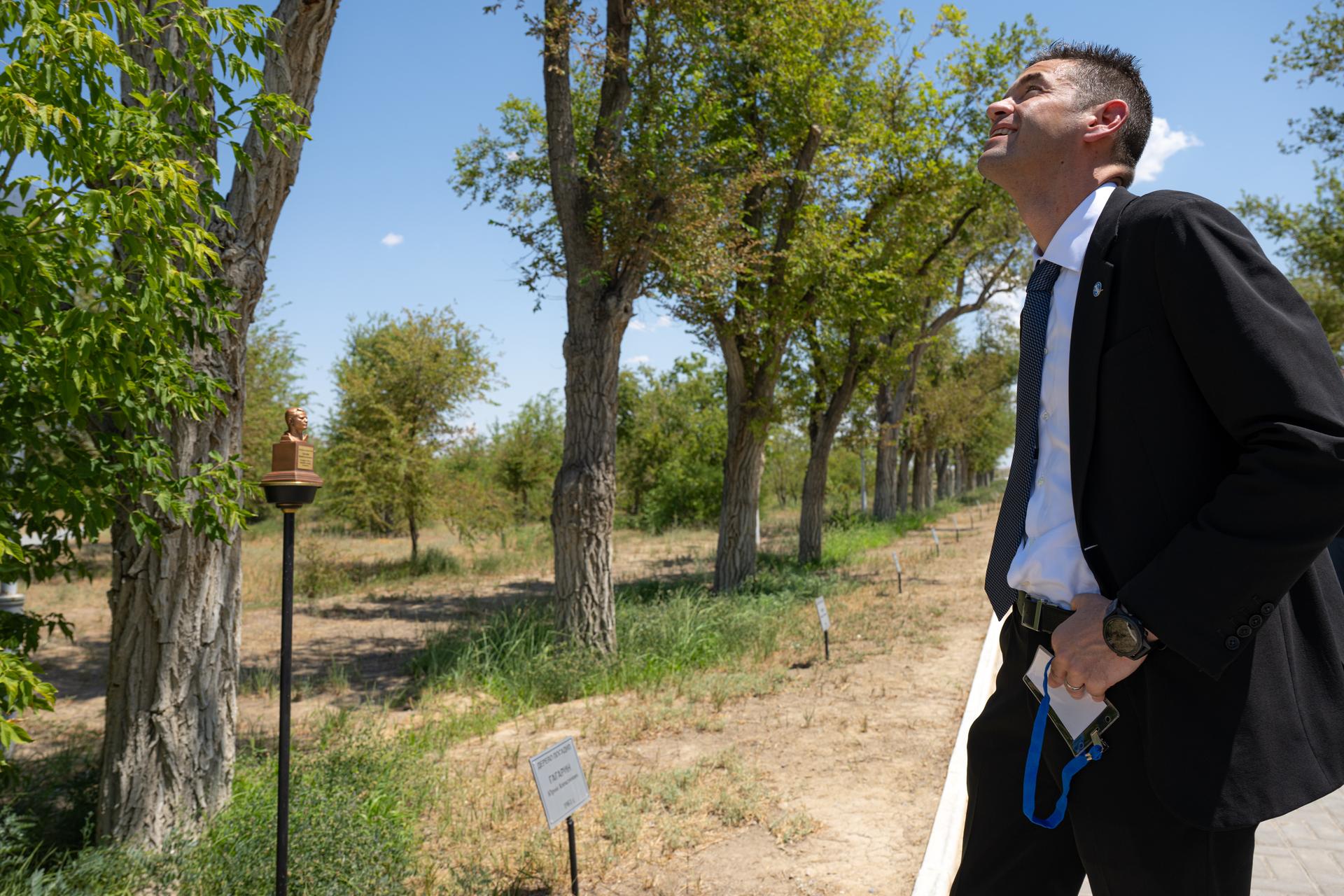 NASA Administrator Jared Isaacman views a tree planted by cosmonaut Yuri Gagarin, Monday, July 13, 2026, at the Cosmonauts Alley at the Cosmonaut Hotel in Baikonur, Kazakhstan. In a tradition dating back to Gagarin’s spaceflight in 1961, cosmonauts and astronauts plant trees at the grove prior to their first mission to space. Photo Credit: (NASA/John Kraus)