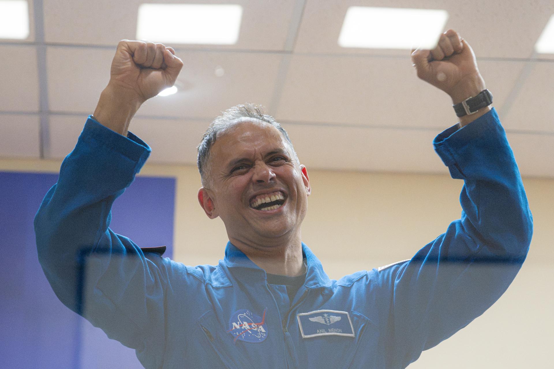 NASA astronaut Anil Menon is seen in quarantine, behind glass, during a press conference, Monday, July 13, 2026, at the Cosmonaut Hotel in Baikonur, Kazakhstan. Expedition 75 crewmembers NASA astronaut Anil Menon and Roscosmos cosmonauts Pyotr Dubrov and Anna Kikina are scheduled to launch aboard the Soyuz MS-29 spacecraft to the International Space Station on July 14. Photo Credit: (NASA/John Kraus)