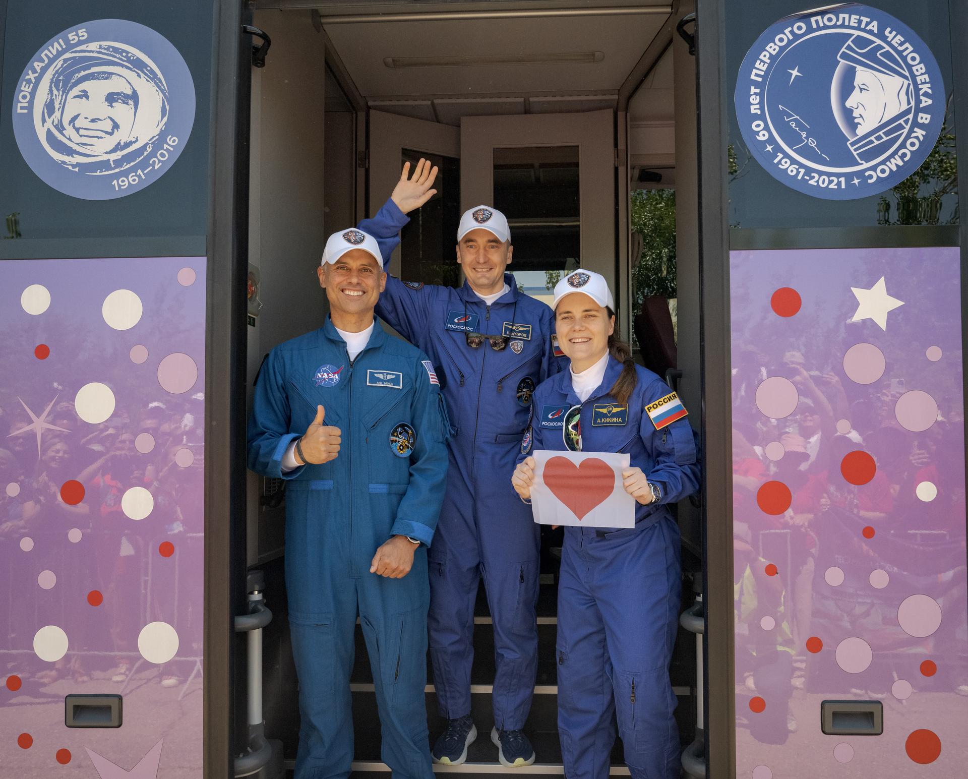 Expedition 75 crew members: NASA astronaut Anil Menon, left, Roscosmos cosmonauts Pyotr Dubrov, and Anna Kikina, right, depart the Cosmonaut Hotel to suit-up for their Soyuz launch, Tuesday, July 14, 2026, in Baikonur, Kazakhstan. The launch will send Menon, Dubrov, and Kikina on a mission to the International Space Station. Photo Credit: (NASA/Bill Ingalls)