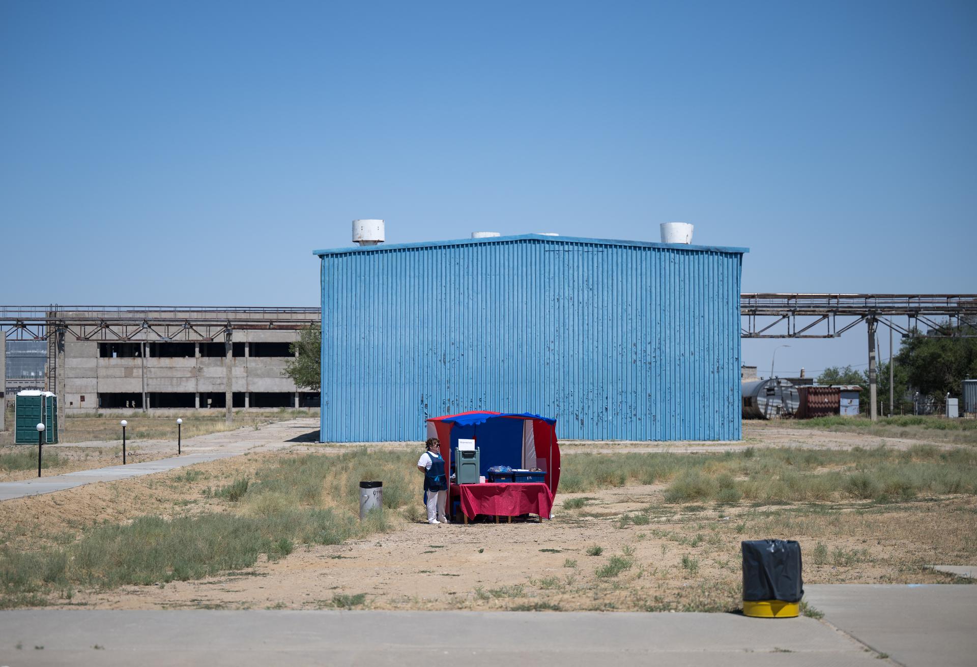 An outdoor cafe is seen outside building 254 of the Baikonur Cosmodrome where Expedition 75 crew members: NASA astronaut Anil Menon, Roscosmos cosmonauts Pyotr Dubrov, and Anna Kikina, will suit up ahead of their Soyuz launch to the International Space Station Tuesday, July 14, 2026 in Baikonur, Kazakhstan. The launch will send Menon, Dubrov, and Kikina on a mission to the International Space Station. Photo Credit: (NASA/Bill Ingalls)