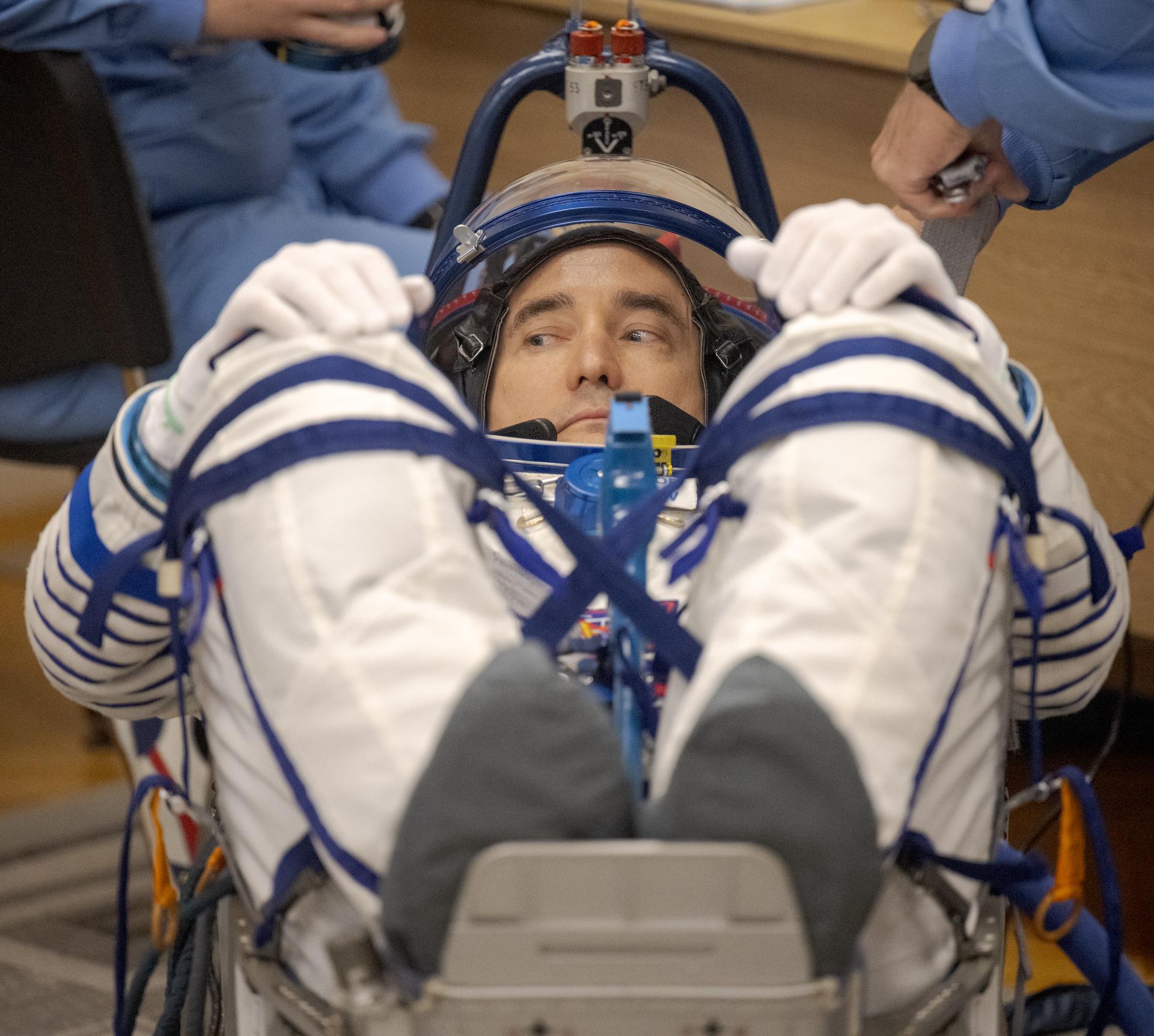 Expedition 75 Roscosmos cosmonaut Pyotr Dubrov has his Russian Sokol suit pressure checked as he and fellow crewmates, Roscosmos cosmonaut Anna Kikina, and NASA astronaut Anil Menon, prepare for their Soyuz launch to the International Space Station Tuesday, July 14, 2026 in Baikonur, Kazakhstan. Photo Credit: (NASA/Bill Ingalls)