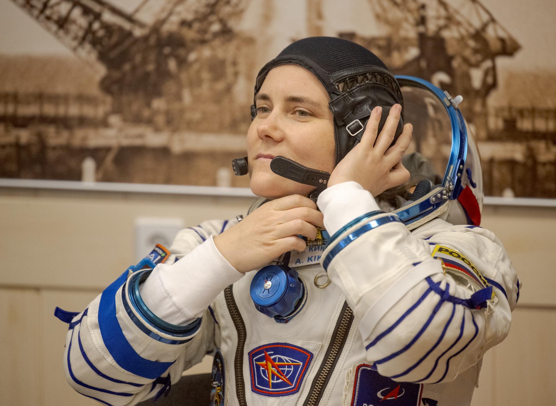 Roscosmos cosmonaut Anna Kikina waits to have her Russian Sokol Suit pressure checked, as she and fellow crewmates, Roscosmos cosmonaut Pyotr Dubrov, and NASA astronaut Anil Menon, prepare for their Soyuz launch to the International Space Station Tuesday, July 14, 2026 in Baikonur, Kazakhstan. Photo Credit: (NASA/Bill Ingalls)