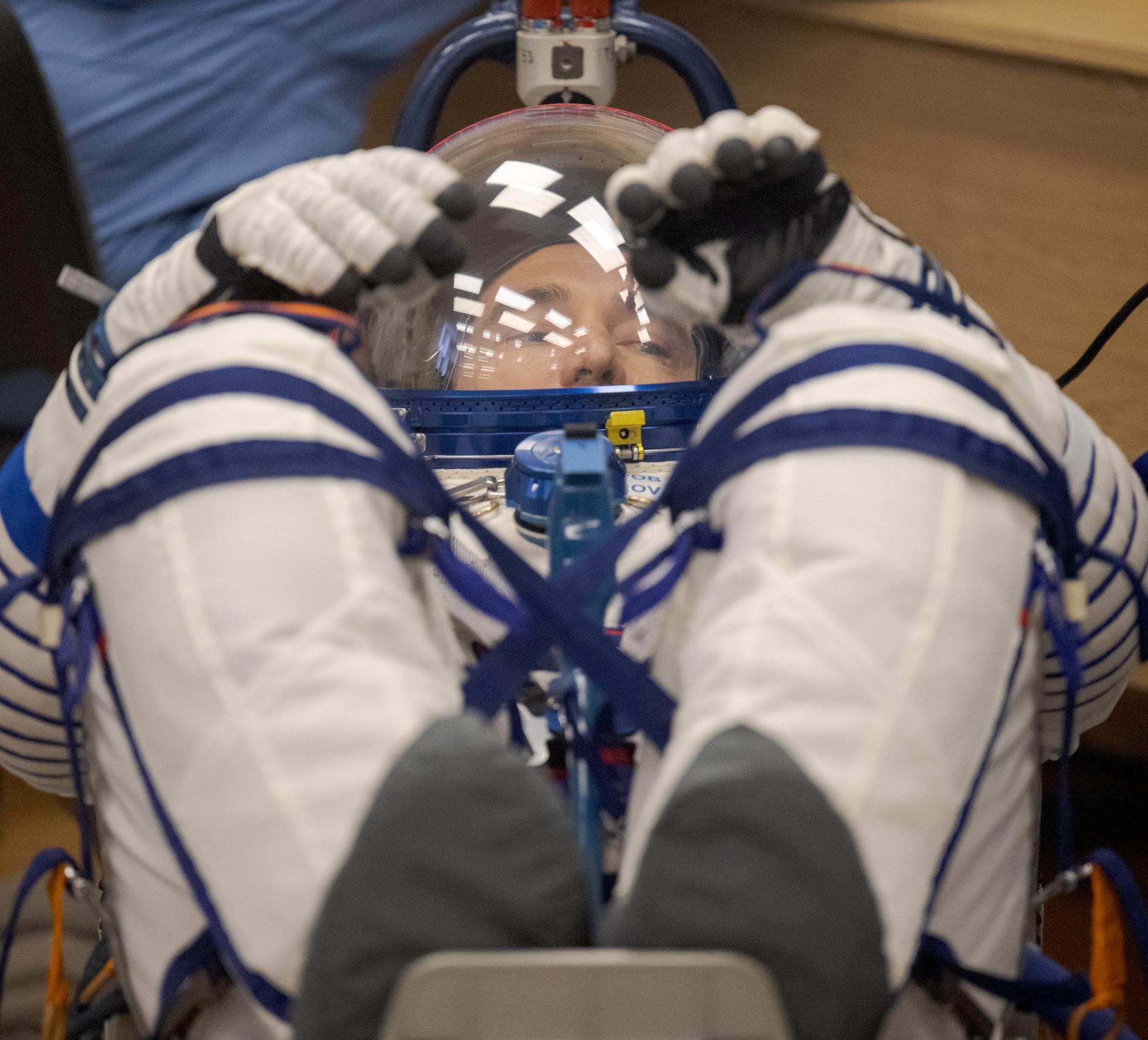 Expedition 75 Roscosmos cosmonaut Pyotr Dubrov has his Russian Sokol suit pressure checked as he and fellow crewmates, Roscosmos cosmonaut Anna Kikina, and NASA astronaut Anil Menon, prepare for their Soyuz launch to the International Space Station Tuesday, July 14, 2026 in Baikonur, Kazakhstan. Photo Credit: (NASA/Bill Ingalls)