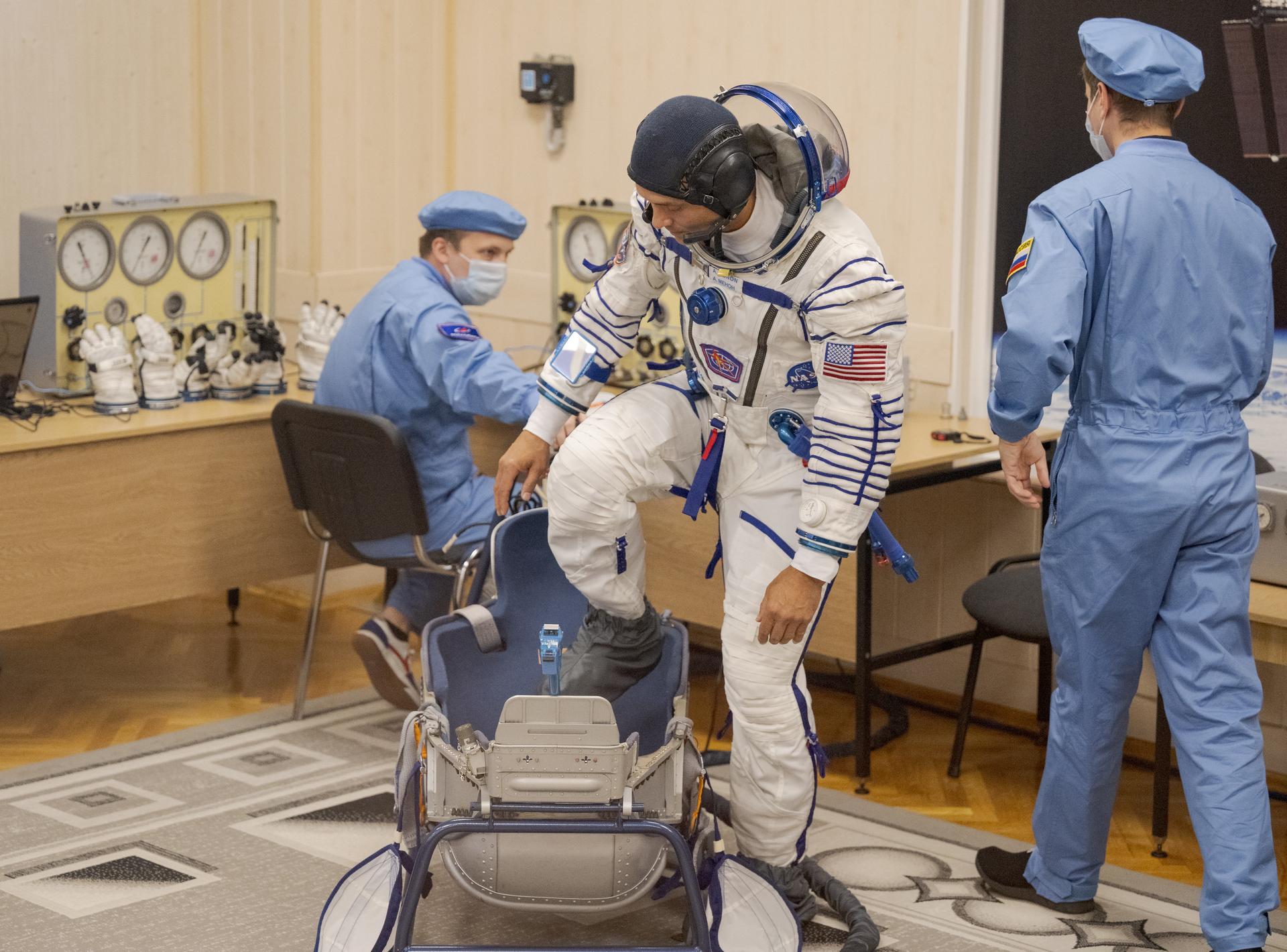 Expedition 75 NASA astronaut Anil Menon has his Russian Sokol suit pressure checked as he and fellow crewmates, Roscosmos cosmonauts Anna Kikina, and Pyotr Dubrov, prepare for their Soyuz launch to the International Space Station Tuesday, July 14, 2026 in Baikonur, Kazakhstan. Photo Credit: (NASA/Bill Ingalls)