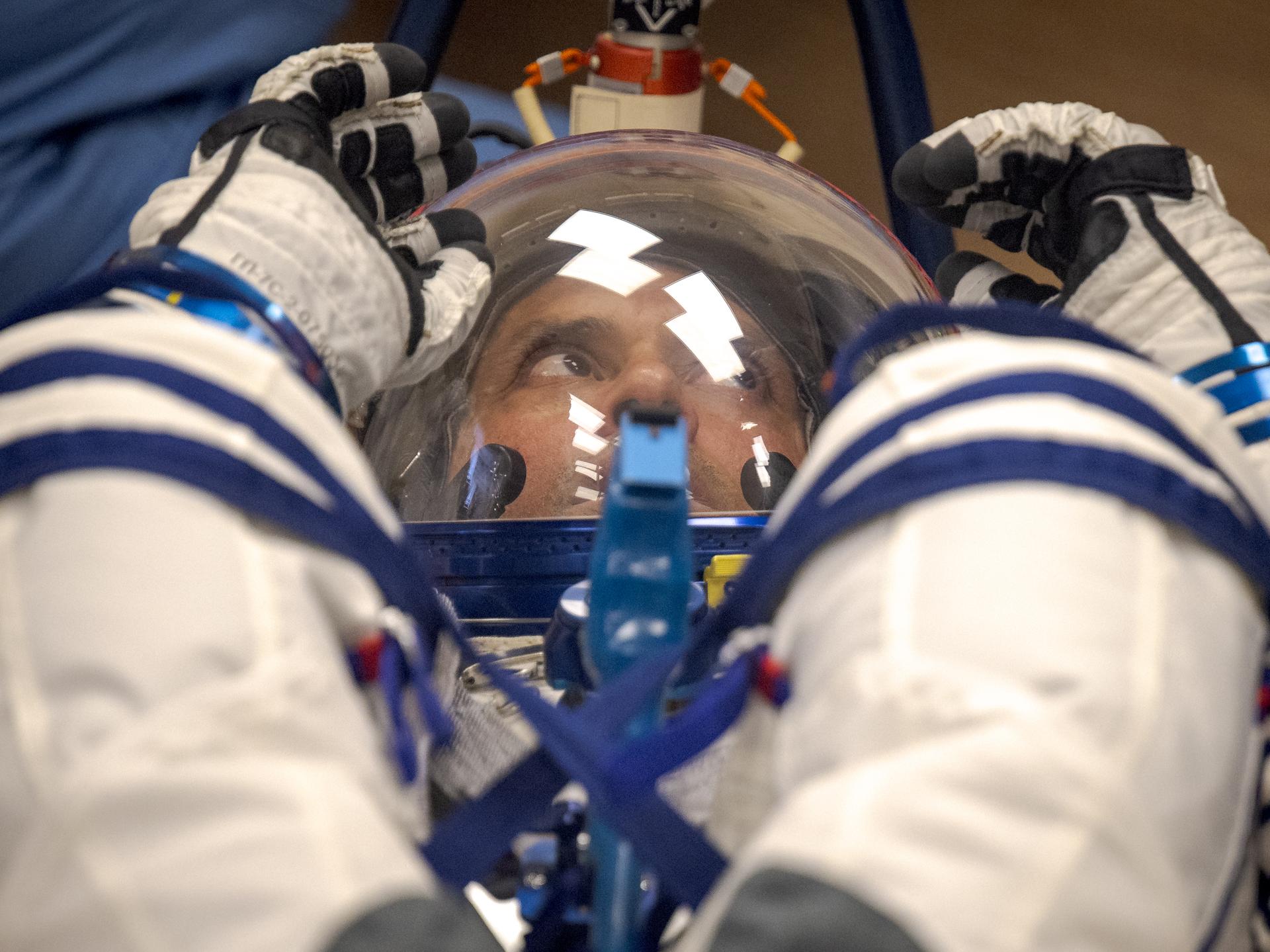 Expedition 75 NASA astronaut Anil Menon has his Russian Sokol suit pressure checked as he and fellow crewmates, Roscosmos cosmonauts Anna Kikina, and Pyotr Dubrov, prepare for their Soyuz launch to the International Space Station Tuesday, July 14, 2026 in Baikonur, Kazakhstan. Photo Credit: (NASA/Bill Ingalls)