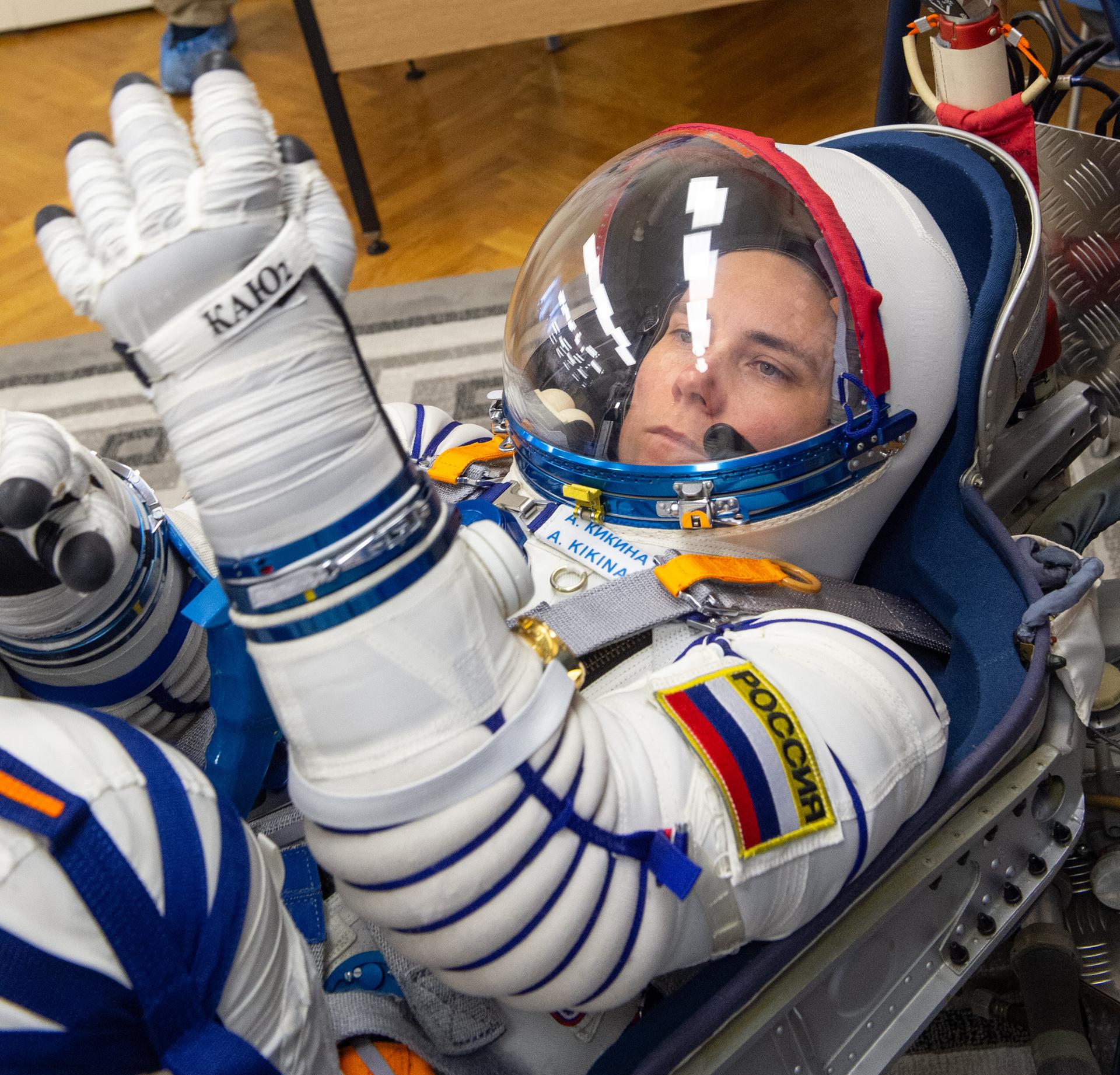 Expedition 75 Roscosmos cosmonaut Anna Kikina has her Russian Sokol suit pressure checked as she and fellow crew mates, Roscosmos cosmonaut Pyotr Dubrov, and NASA astronaut Anil Menon, prepare for their Soyuz launch to the International Space Station Tuesday, July 14, 2026 in Baikonur, Kazakhstan. Photo Credit: (NASA/GCTC/Pavel Shvets)