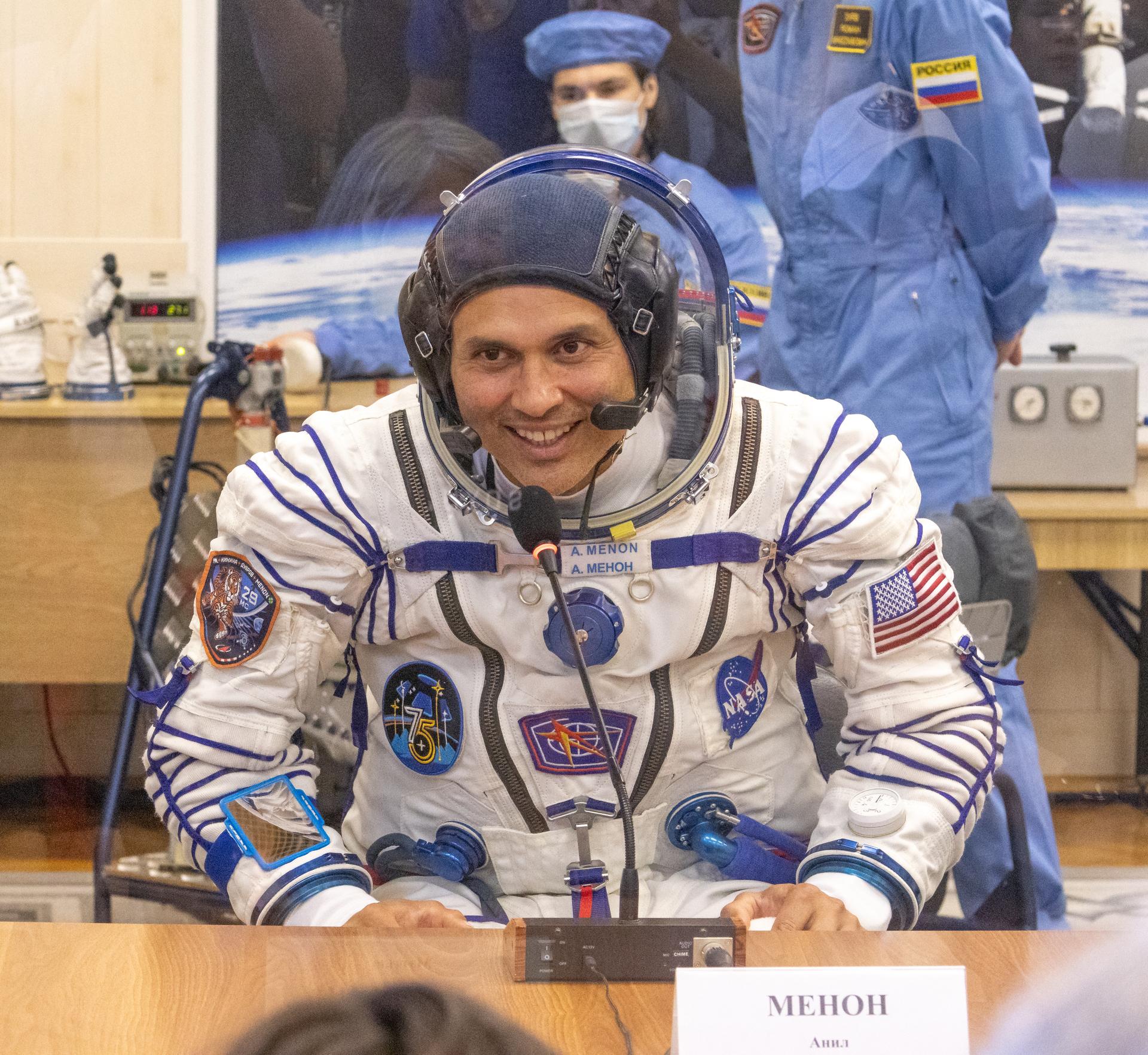 Expedition 75 NASA astronaut Anil Menon, talks to family and friends as he and Roscosmos cosmonauts Pyotr Dubrov, and Anna Kikina prepare for their Soyuz launch to the International Space Station Tuesday, July 14, 2026 in Baikonur, Kazakhstan. The launch will send Menon, Dubrov, and Kikina on a mission to the International Space Station. Photo Credit: (NASA/Victor Zelentsov)