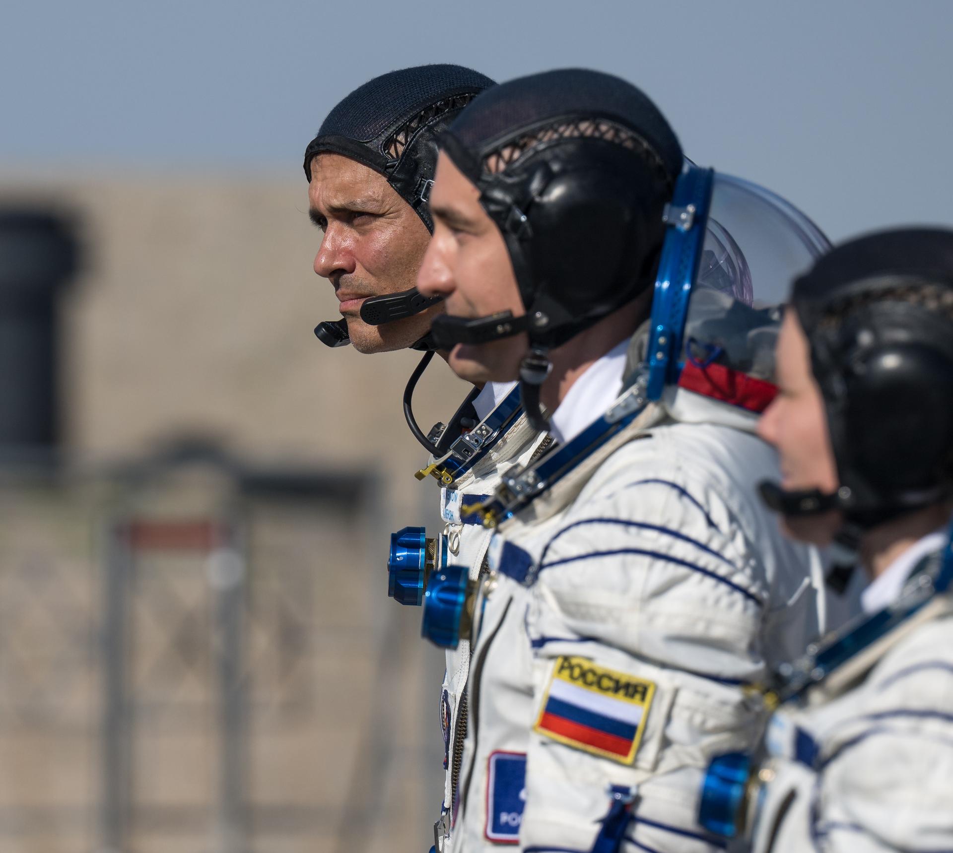 Expedition 75 crewmembers: NASA astronaut Anil Menon, left, Roscosmos cosmonauts Pyotr Dubrov, and Anna Kikina, right, arrive at the launch pad to board the Soyuz MS-29 spacecraft for launch, Tuesday, July 14, 2026 at the Baikonur Cosmodrome in Kazakhstan. Launch of the Soyuz rocket will send the trio on a mission to the International Space Station. Photo Credit: (NASA/Bill Ingalls)