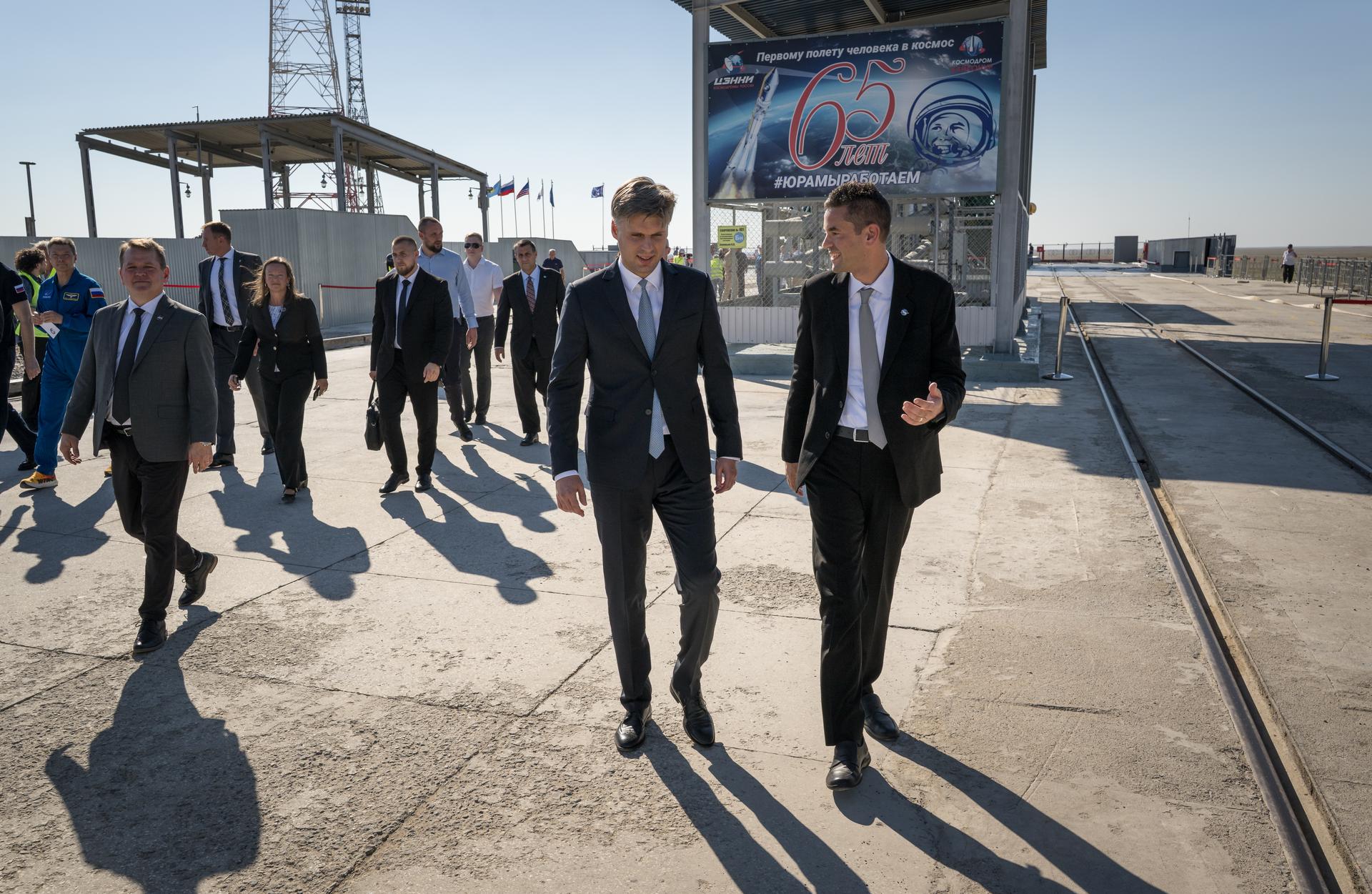 Roscosmos Director General Dmitry Bakanov, left, and NASA Administrator Jared Isaacman, right, talk after saying farewell to Expedition 75 crewmembers NASA astronaut Anil Menon, Roscosmos cosmonauts Pyotr Dubrov, and Anna Kikina, prior to launch of the Soyuz MS-29, Tuesday, July 14, 2026 at the Baikonur Cosmodrome in Kazakhstan. Launch of the Soyuz rocket will send the trio on a mission to the International Space Station. Photo Credit: (NASA/Bill Ingalls)