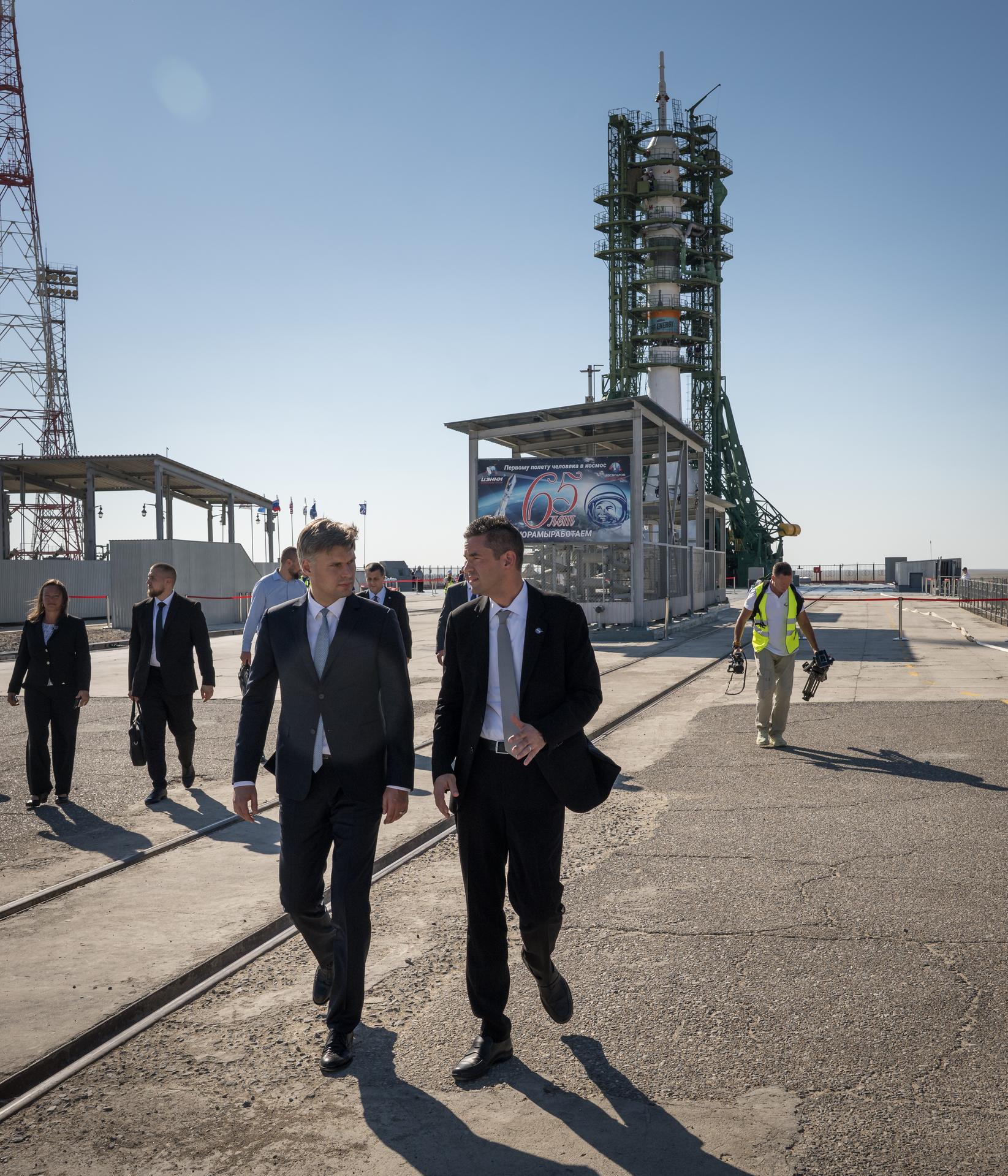 Roscosmos Director General Dmitry Bakanov, left, and NASA Administrator Jared Isaacman, right, talk after saying farewell to Expedition 75 crewmembers NASA astronaut Anil Menon, Roscosmos cosmonauts Pyotr Dubrov, and Anna Kikina, prior to launch of the Soyuz MS-29, Tuesday, July 14, 2026 at the Baikonur Cosmodrome in Kazakhstan. Launch of the Soyuz rocket will send the trio on a mission to the International Space Station. Photo Credit: (NASA/Bill Ingalls)