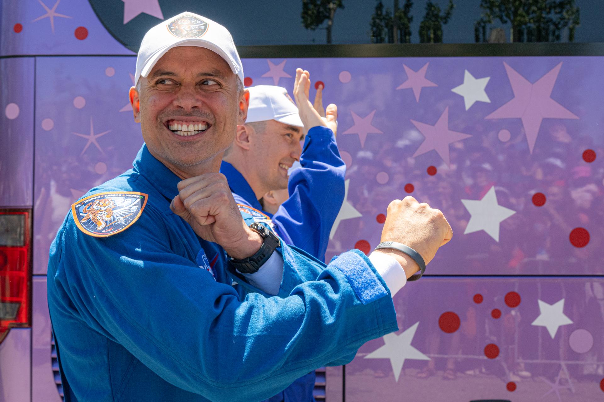 Expedition 75 crewmembers NASA astronaut Anil Menon, foreground, and Roscosmos cosmonauts Pyotr Dubrov and Anna Kikina, background, depart the Cosmonaut Hotel to suit up for launch, Tuesday, July 14, 2026, in Baikonur, Kazakhstan. The launch will send the trio to the International Space Station aboard the Soyuz MS-29 spacecraft. Photo Credit: (NASA/John Kraus)