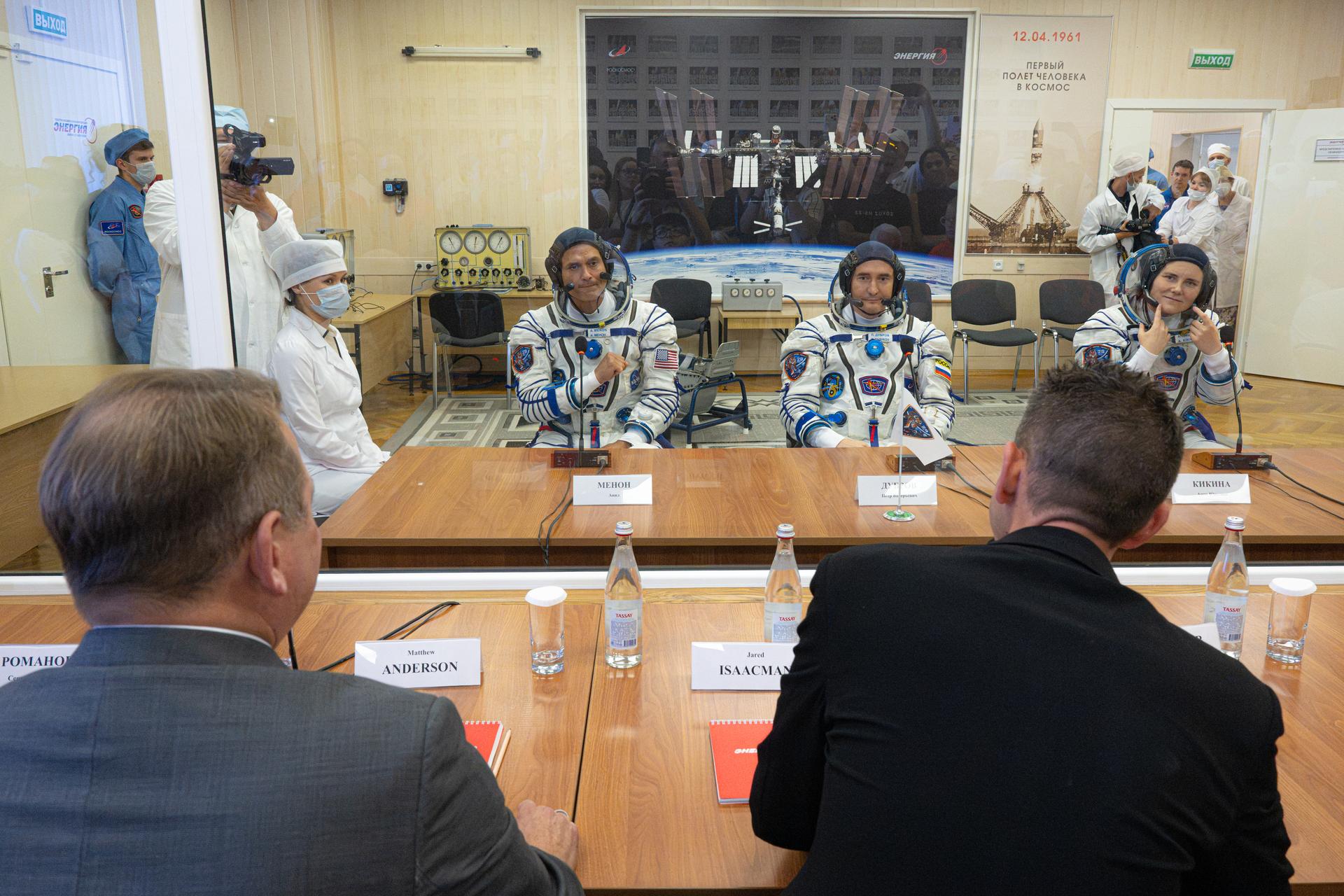 NASA Administrator Jared Isaacman, right, and NASA Deputy Administrator Matt Anderson, left, speak with Expedition 75 crewmembers NASA astronaut Anil Menon and Roscosmos cosmonauts Pyotr Dubrov and Anna Kikina following pressure checks of their Russian Sokul suits before launch, Tuesday, July 14, 2026, at the Baikonur Cosmodrome in Kazakhstan. The launch will send NASA astronaut Anil Menon and Roscosmos cosmonauts Pyotr Dubrov and Anna Kikina to the International Space Station aboard the Soyuz MS-29 spacecraft. Photo Credit: (NASA/John Kraus)