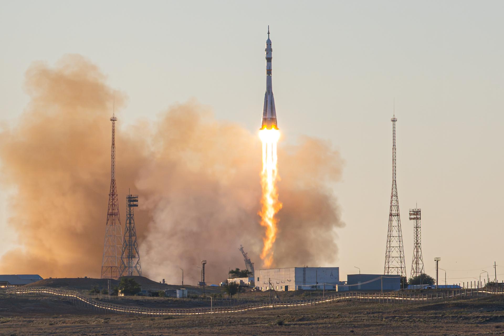 A Soyuz rocket launches to the International Space Station with Expedition 75 crewmembers NASA astronaut Anil Menon and Roscosmos cosmonauts Pyotr Dubrov and Anna Kikina, Tuesday, July 14, 2026, at Site 31/6 at the Baikonur Cosmodrome in Kazakhstan. The trio lifted off for the Soyuz MS-29 mission at 7:47 p.m. local time to begin their long-duration stay aboard the orbital outpost. Photo Credit: (NASA/John Kraus)