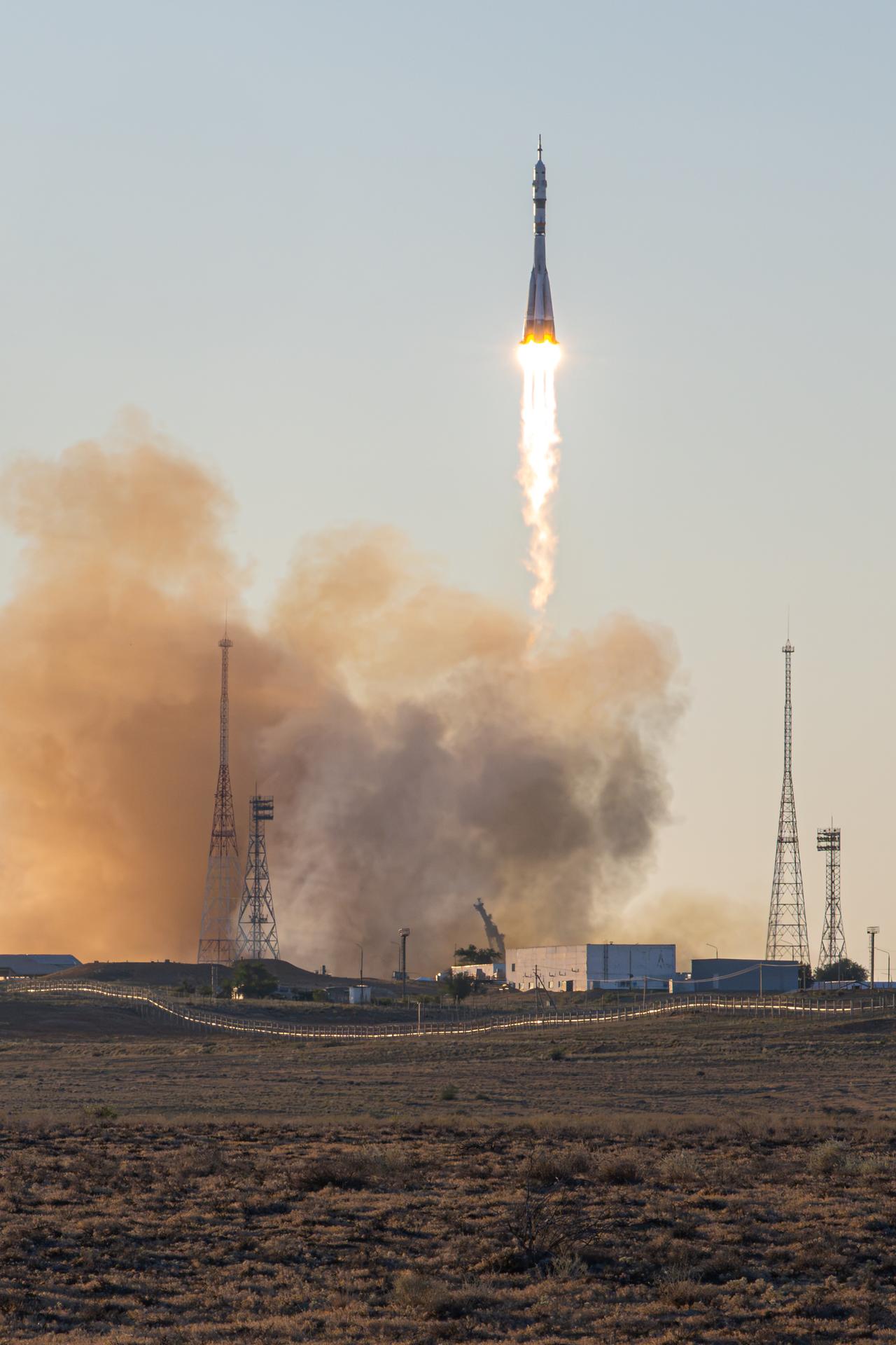 A Soyuz rocket launches to the International Space Station with Expedition 75 crewmembers NASA astronaut Anil Menon and Roscosmos cosmonauts Pyotr Dubrov and Anna Kikina, Tuesday, July 14, 2026, at Site 31/6 at the Baikonur Cosmodrome in Kazakhstan. The trio lifted off for the Soyuz MS-29 mission at 7:47 p.m. local time to begin their long-duration stay aboard the orbital outpost. Photo Credit: (NASA/John Kraus)