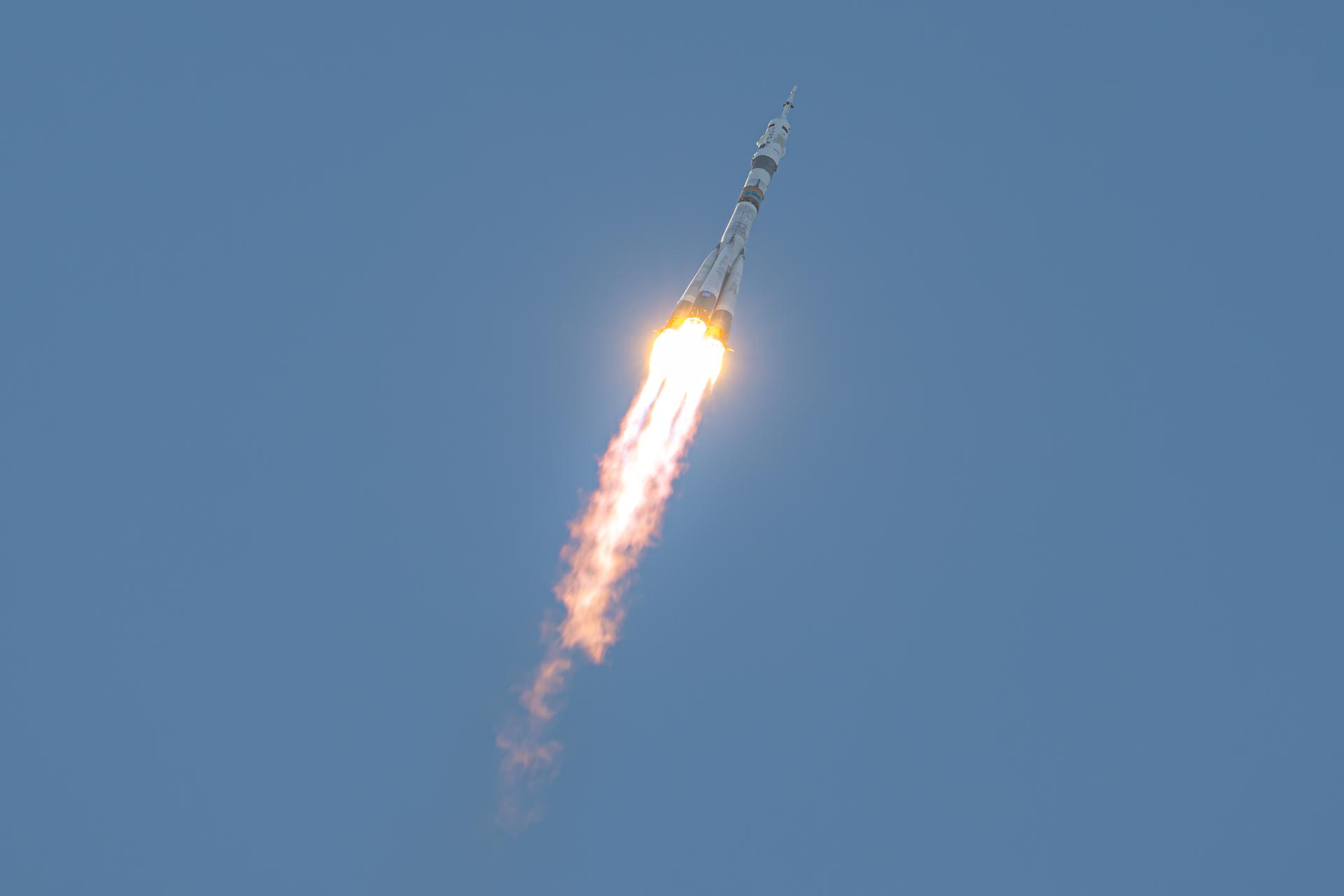A Soyuz rocket launches to the International Space Station with Expedition 75 crewmembers NASA astronaut Anil Menon and Roscosmos cosmonauts Pyotr Dubrov and Anna Kikina, Tuesday, July 14, 2026, at Site 31/6 at the Baikonur Cosmodrome in Kazakhstan. The trio lifted off for the Soyuz MS-29 mission at 7:47 p.m. local time to begin their long-duration stay aboard the orbital outpost. Photo Credit: (NASA/John Kraus)
