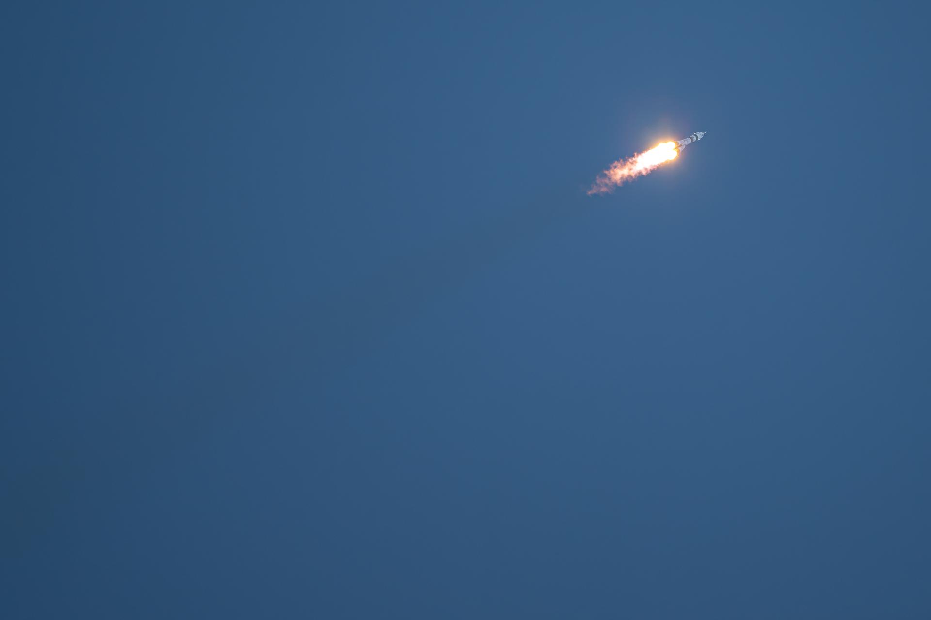 A Soyuz rocket launches to the International Space Station with Expedition 75 crewmembers NASA astronaut Anil Menon and Roscosmos cosmonauts Pyotr Dubrov and Anna Kikina, Tuesday, July 14, 2026, at Site 31/6 at the Baikonur Cosmodrome in Kazakhstan. The trio lifted off for the Soyuz MS-29 mission at 7:47 p.m. local time to begin their long-duration stay aboard the orbital outpost. Photo Credit: (NASA/John Kraus)