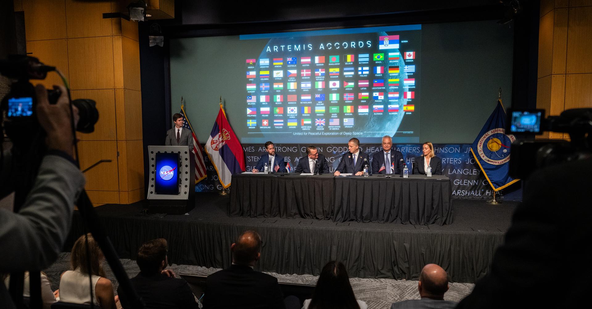 NASA Deputy Administrator Matt Anderson, fourth from right, delivers remarks alongside, seated from left to right, Assistant Secretary of State for Oceans and International Environmental and Scientific Affairs Wesley Brooks, Minister of Foreign Affairs Marko Đurić, Ambassador of Serbia to the Unites States Dragan Šutanovac, and State Secretary at the Ministry of Science, Technological Development & Innovation Marija Gnjatović, during an Artemis Accords signing ceremony Thursday, July 16, 2026, at the Mary W. Jackson NASA Headquarters building in Washington. Serbia is the 69th country to sign the Artemis Accords, which establish a practical set of principles to guide space exploration cooperation among nations participating in NASA’s Artemis program. Photo Credit: (NASA/Keegan Barber)