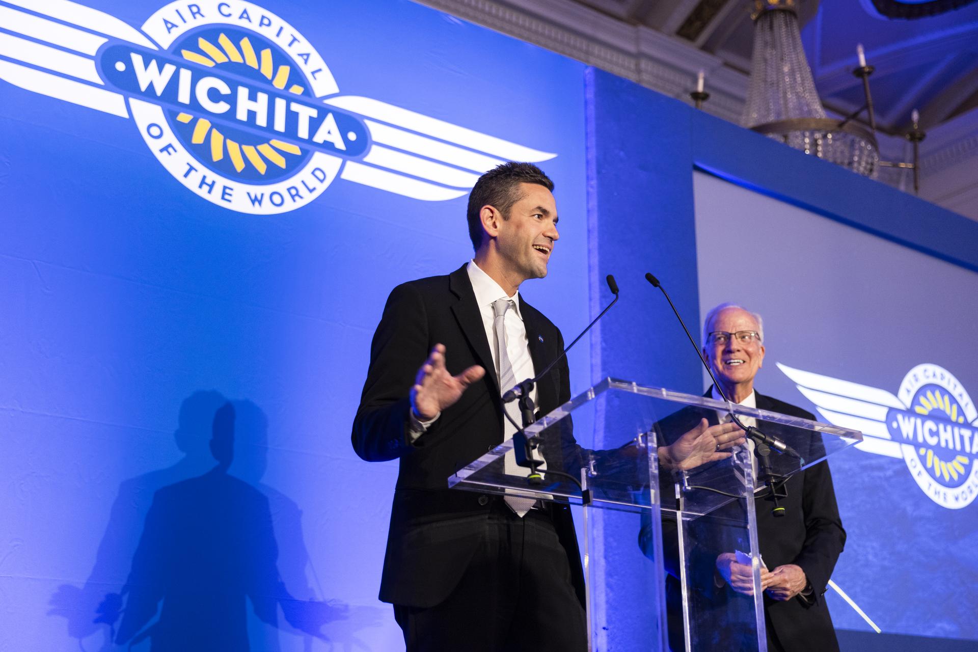 Jared Isaacman speaks at Air Capital of the World Celebration, main kick-off event for Farnborough International Airshow in the United Kingdom, pictured with Senator Jerry Moran (R-Kan).