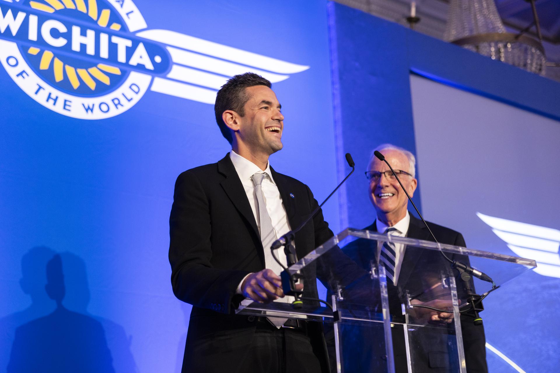 Jared Isaacman speaks at Air Capital of the World Celebration, main kick-off event for Farnborough International Airshow in the United Kingdom, pictured with Senator Jerry Moran (R-Kan).