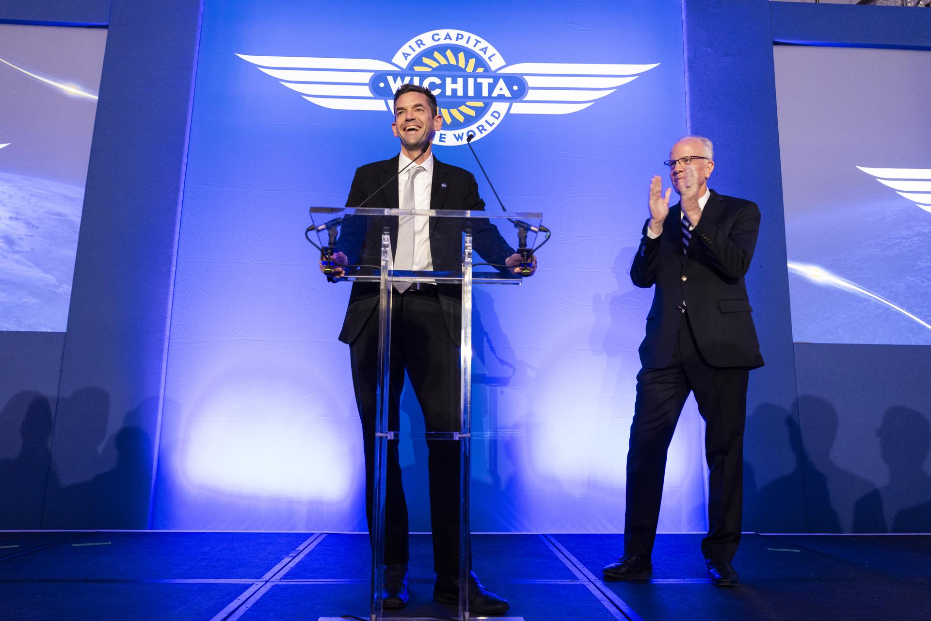Jared Isaacman speaks at Air Capital of the World Celebration, main kick-off event for Farnborough International Airshow in the United Kingdom, pictured with Senator Jerry Moran (R-Kan).