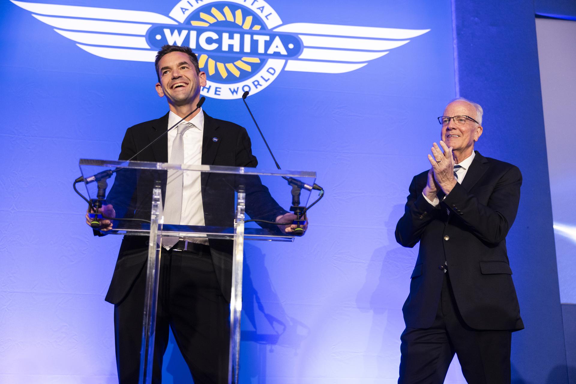 Jared Isaacman speaks at Air Capital of the World Celebration, main kick-off event for Farnborough International Airshow in the United Kingdom, pictured with Senator Jerry Moran (R-Kan).