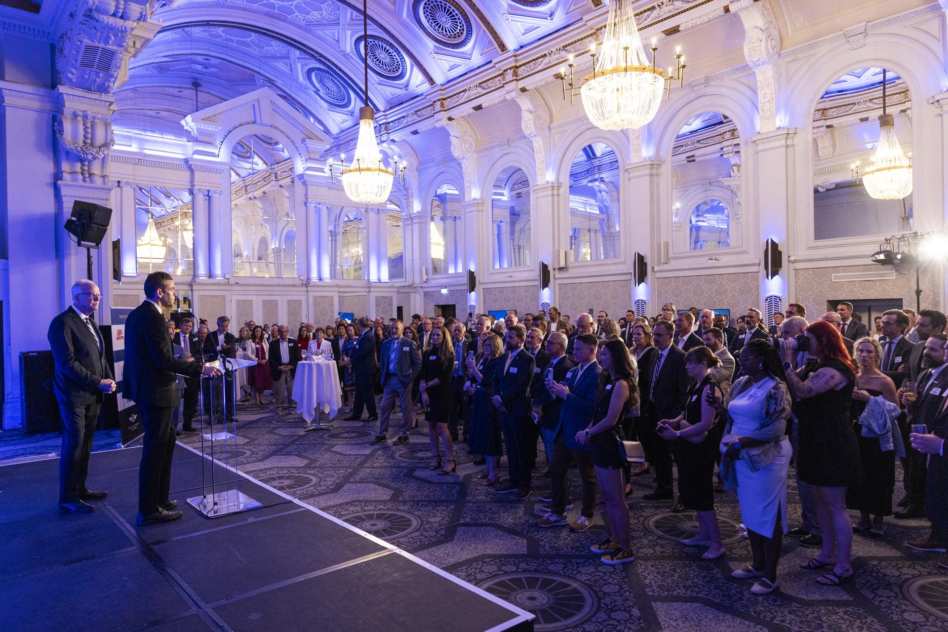 Jared Isaacman speaks at Air Capital of the World Celebration, main kick-off event for Farnborough International Airshow in the United Kingdom, pictured with Senator Jerry Moran (R-Kan).
