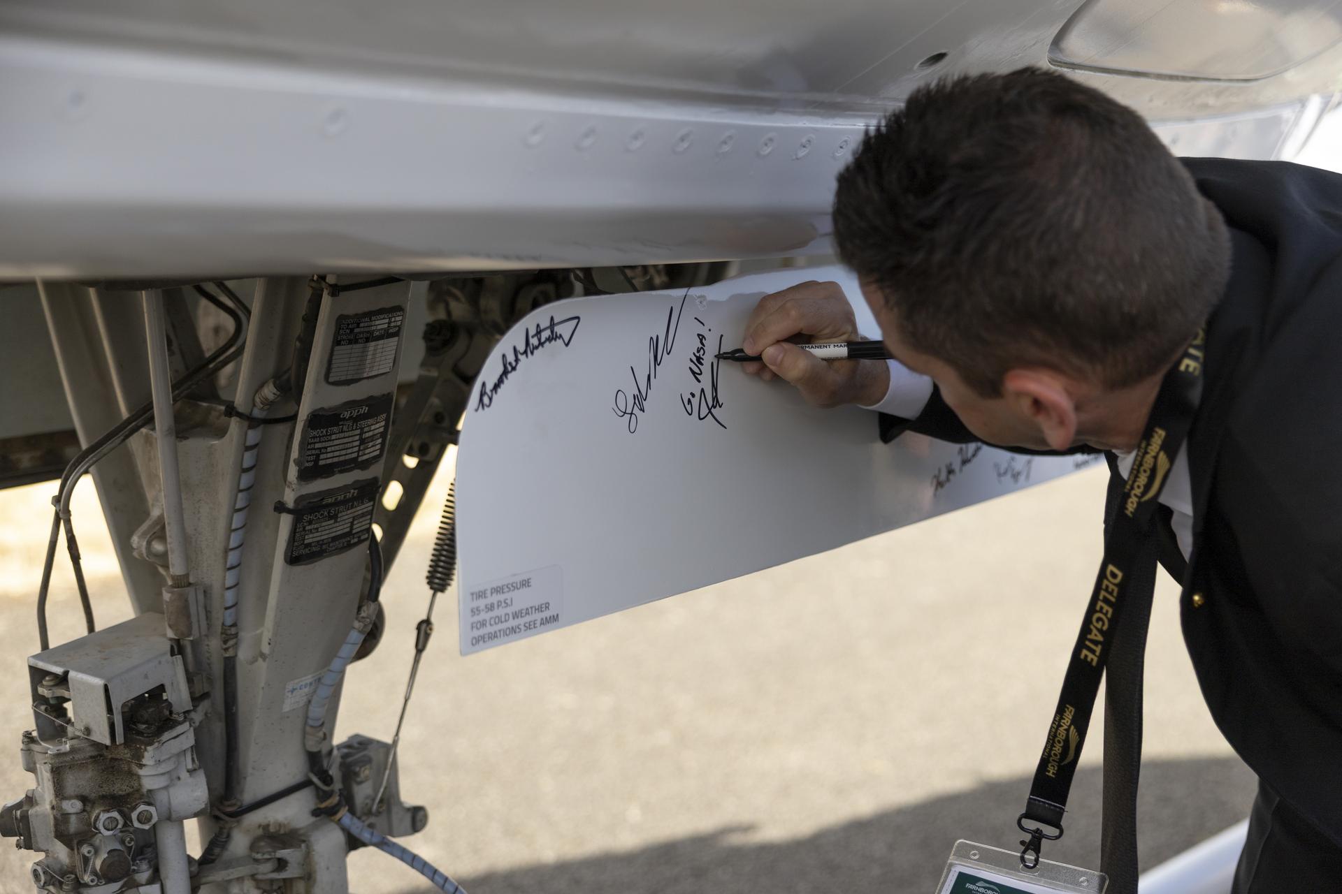Jared Isaacman tours NASA’s Electrified Powertrain Flight Demonstration aircraft at the Farnborough International Airshow in Farnborough, UK.